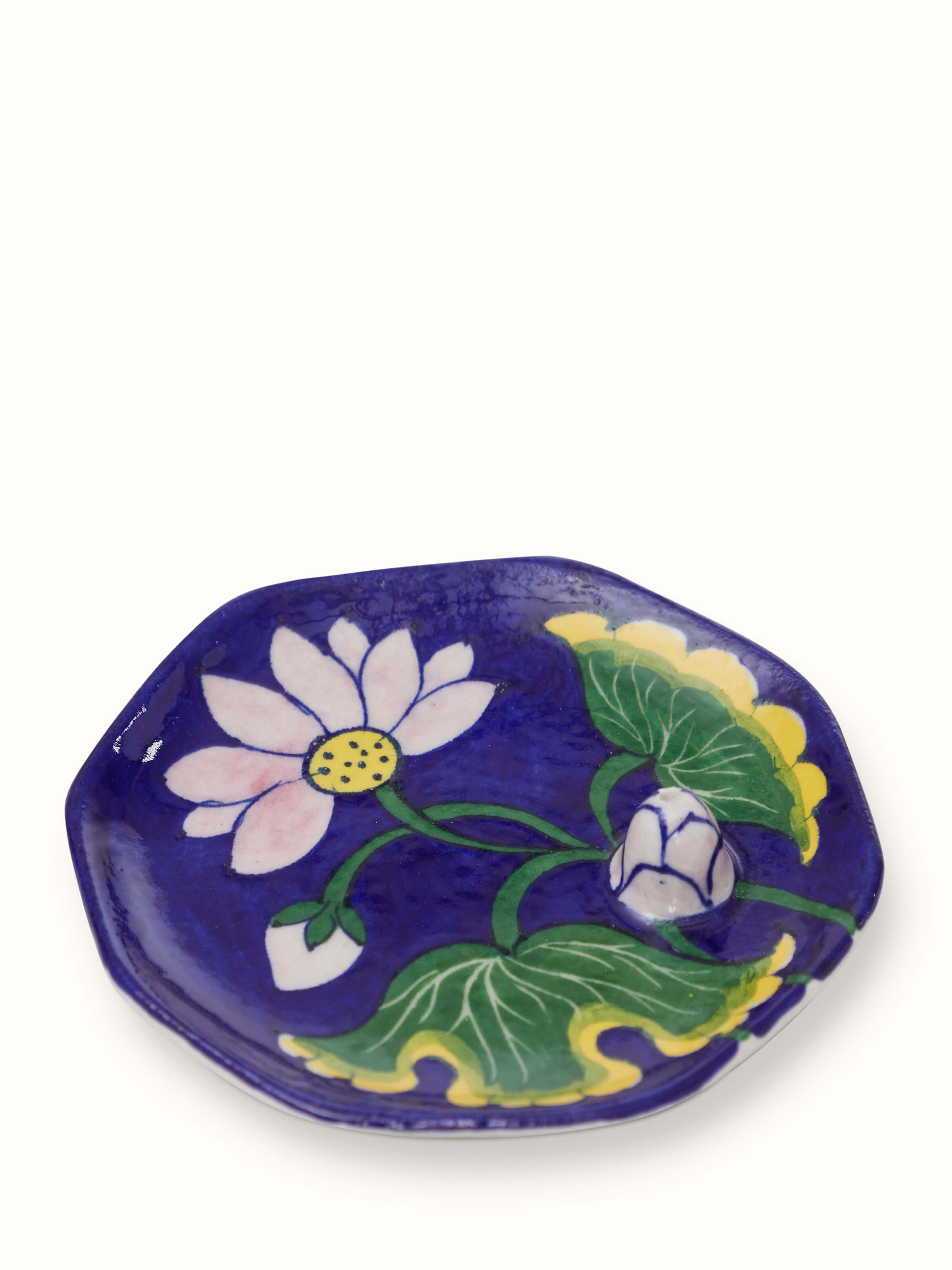 Front view of blue pottery stoneware lotus incense stick holder showcasing intricate designs and finish