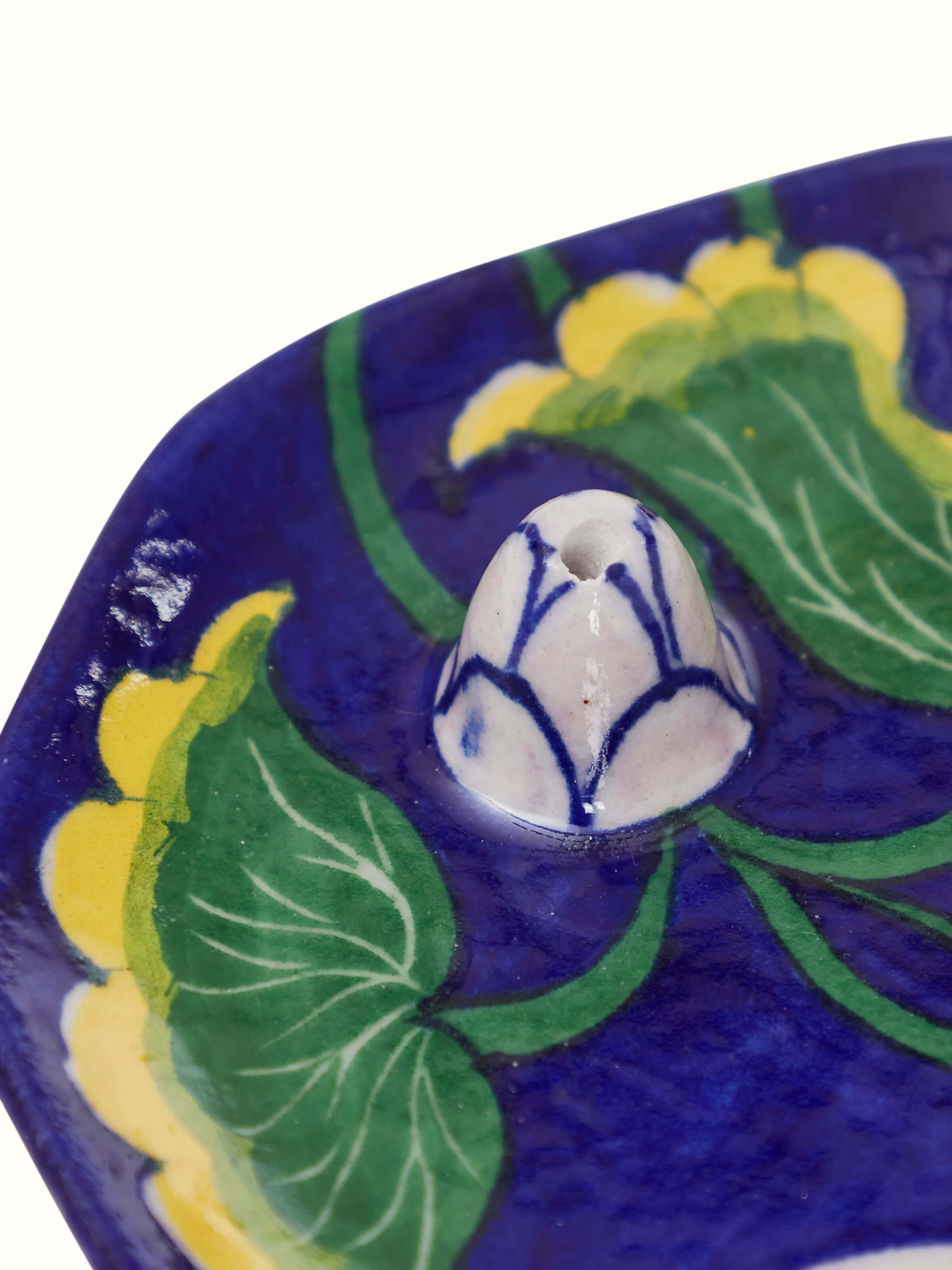 Different angle of blue pottery stoneware lotus incense stick holder showing unique design elements