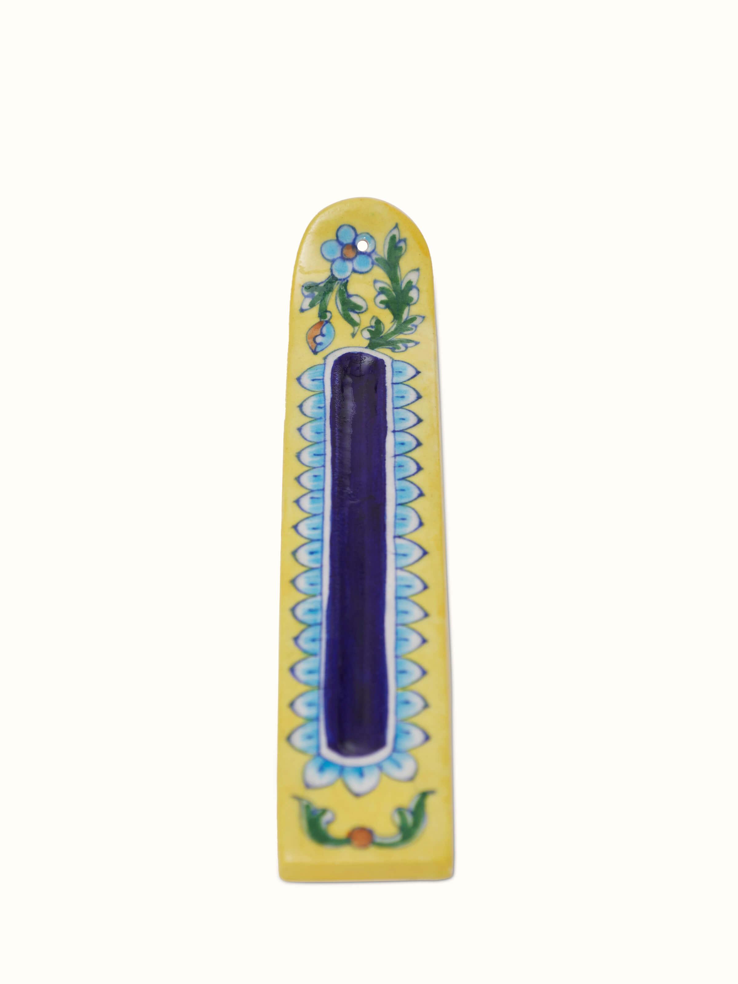 Front view of blue pottery stoneware incense holder in yellow color, highlighting its unique glaze and design.