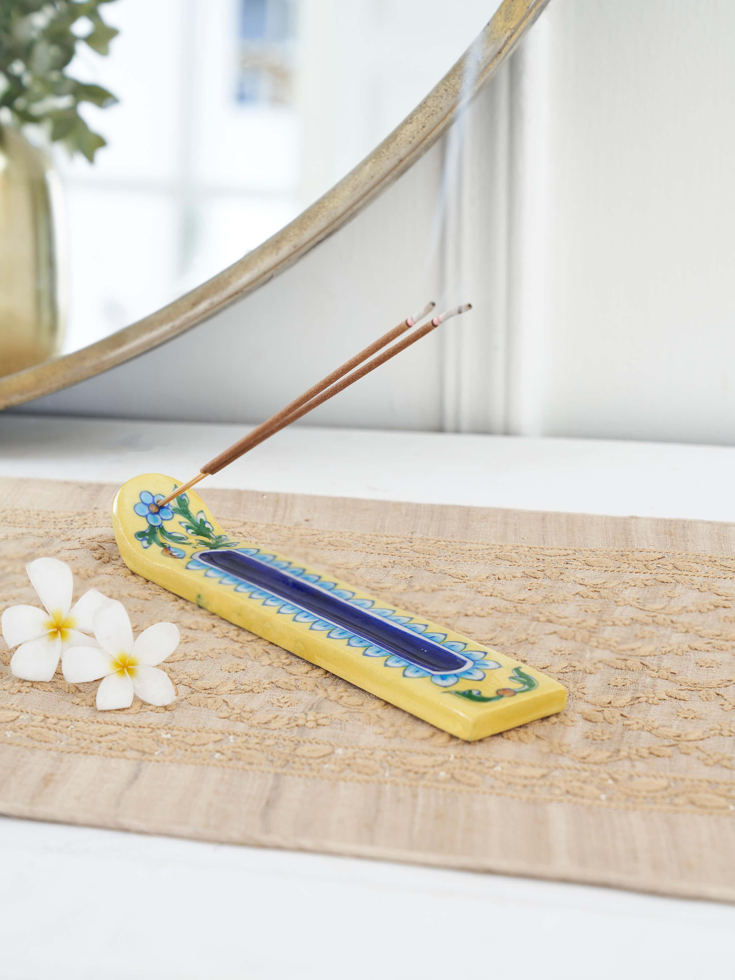Side view of blue pottery stoneware incense holder in yellow color, showcasing the craftsmanship and color detail.