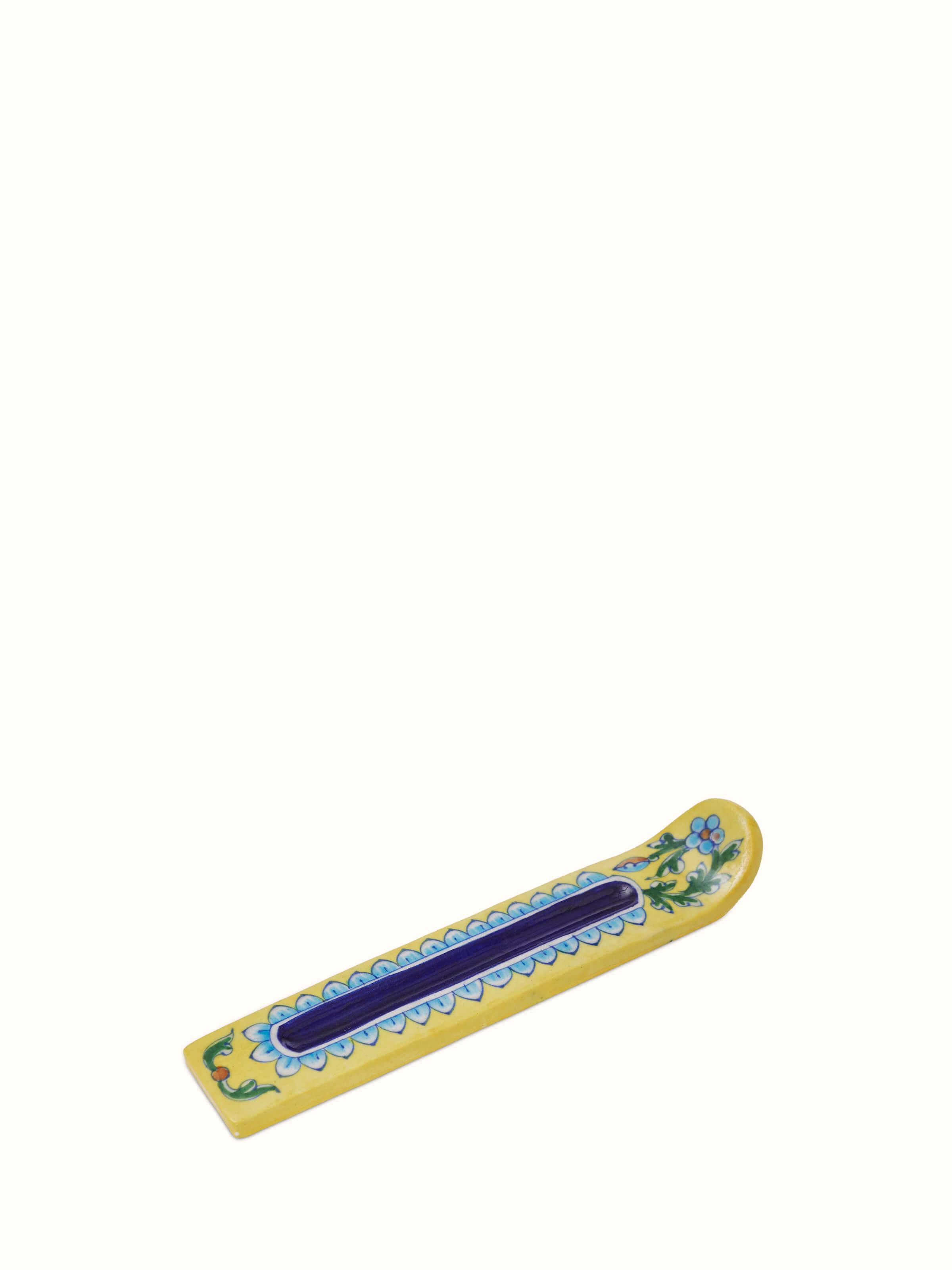 Full view of blue pottery stoneware incense holder in yellow color, emphasizing its functional design and vibrant hue.