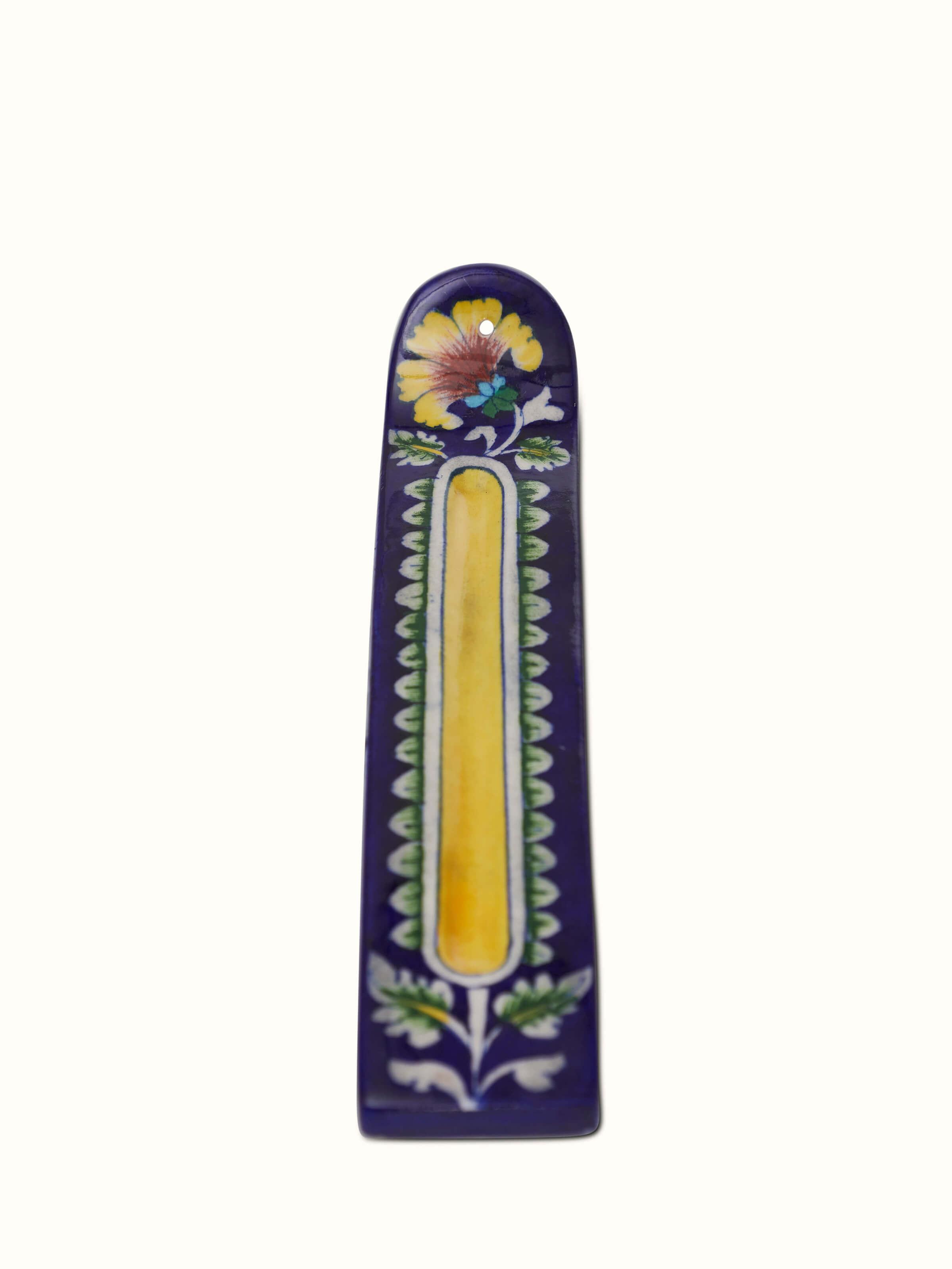 Front view of blue pottery stoneware leaf incense holder featuring its artistic leaf design and vibrant color.