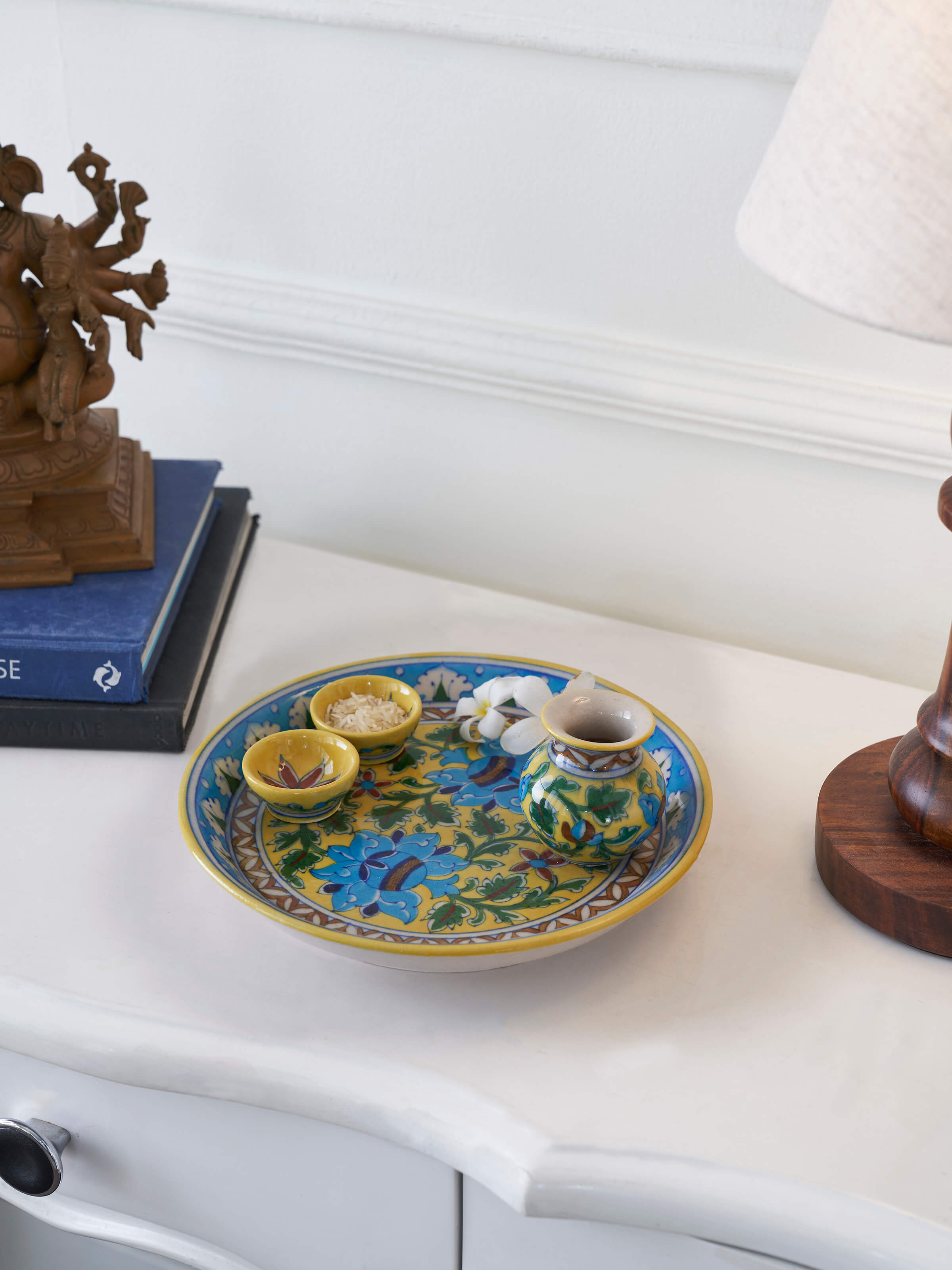 Close-up view of polished blue pottery stoneware pooja thali set, highlighting the fine blue pottery details.