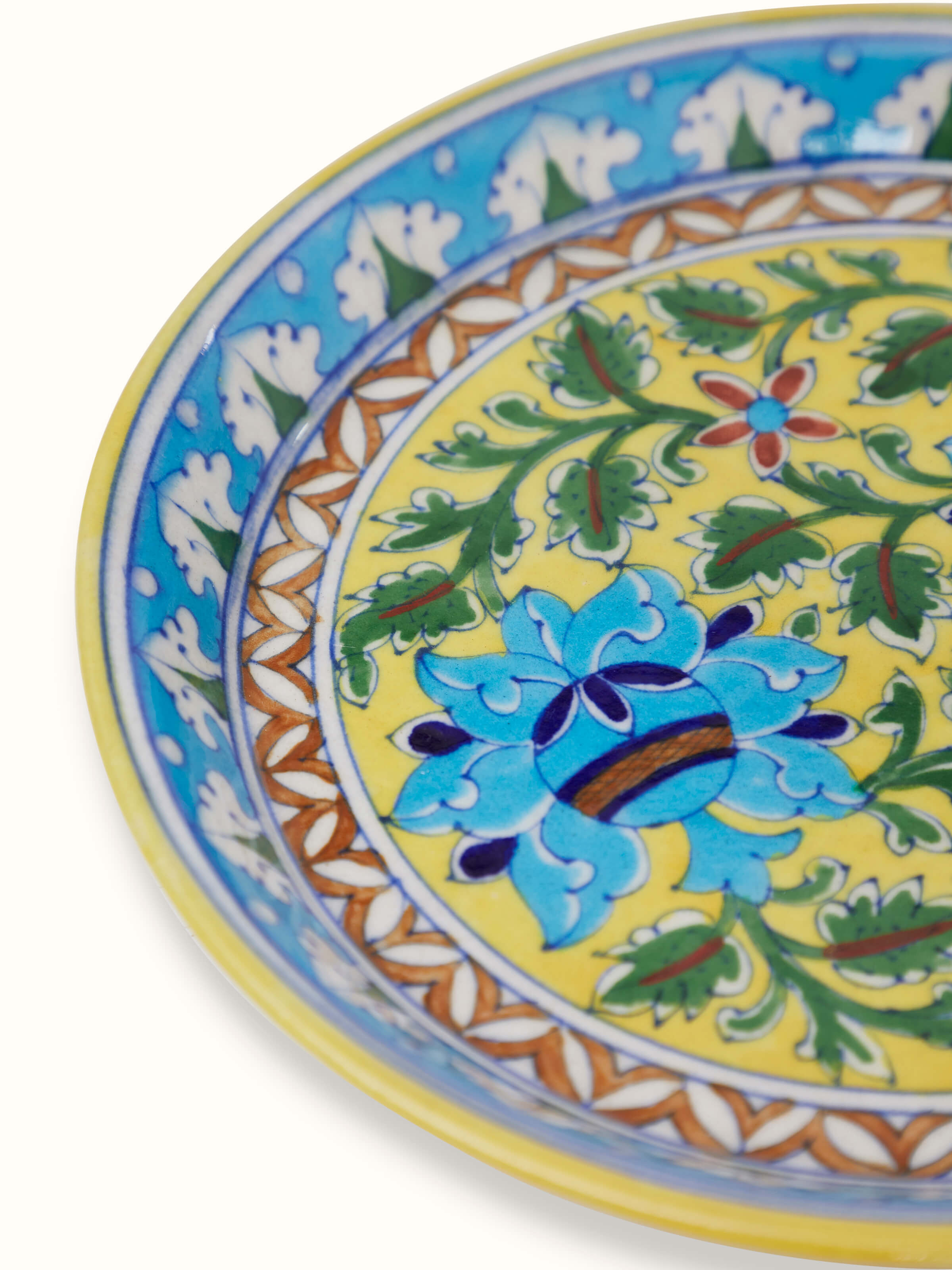 Detailed view of polished blue pottery stoneware pooja thali set, focusing on the intricate blue patterns and design.