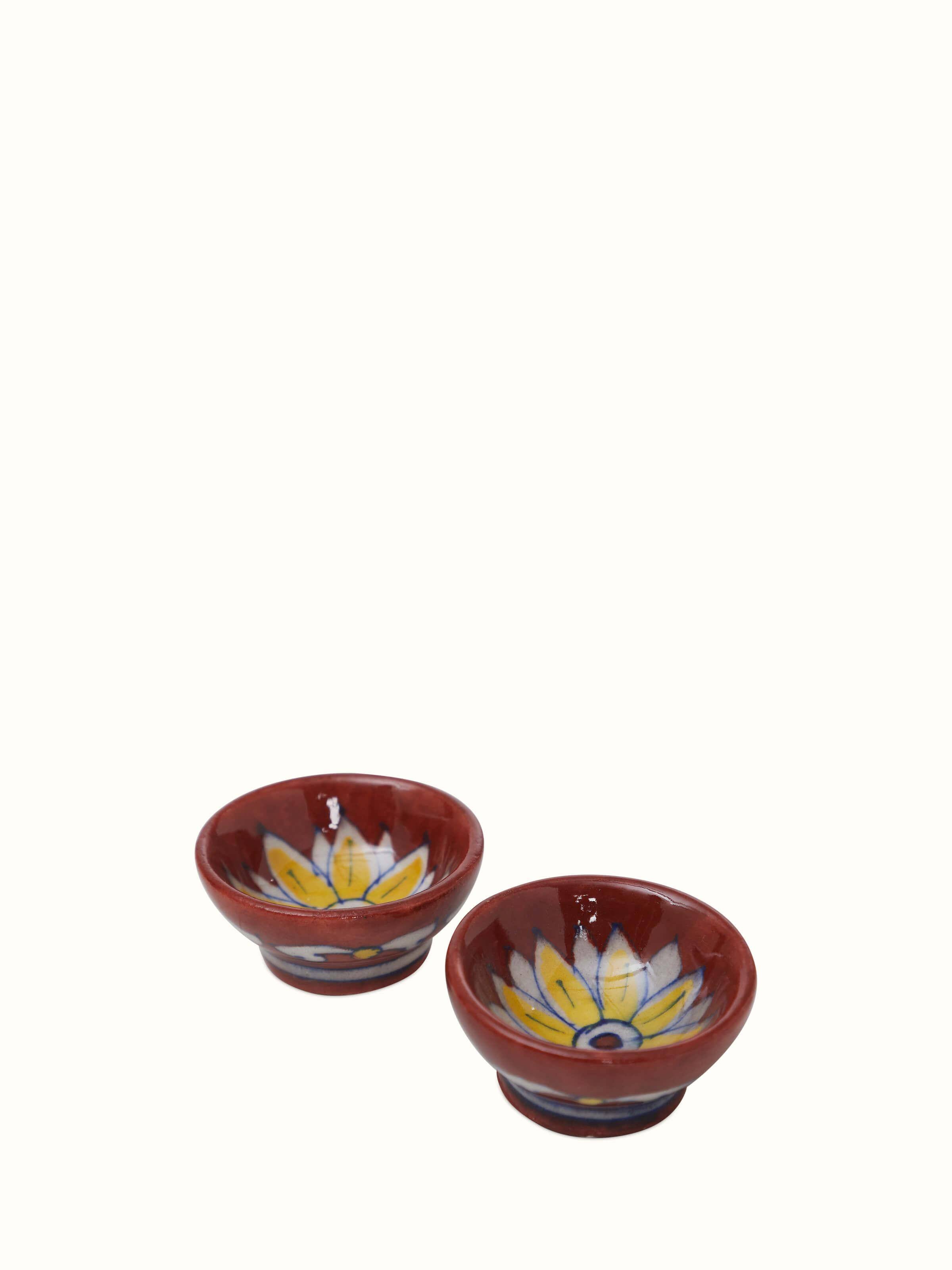 Close-up of Polished Blue Pottery Stoneware Pooja Thali Set maroon color, highlighting the intricate design details