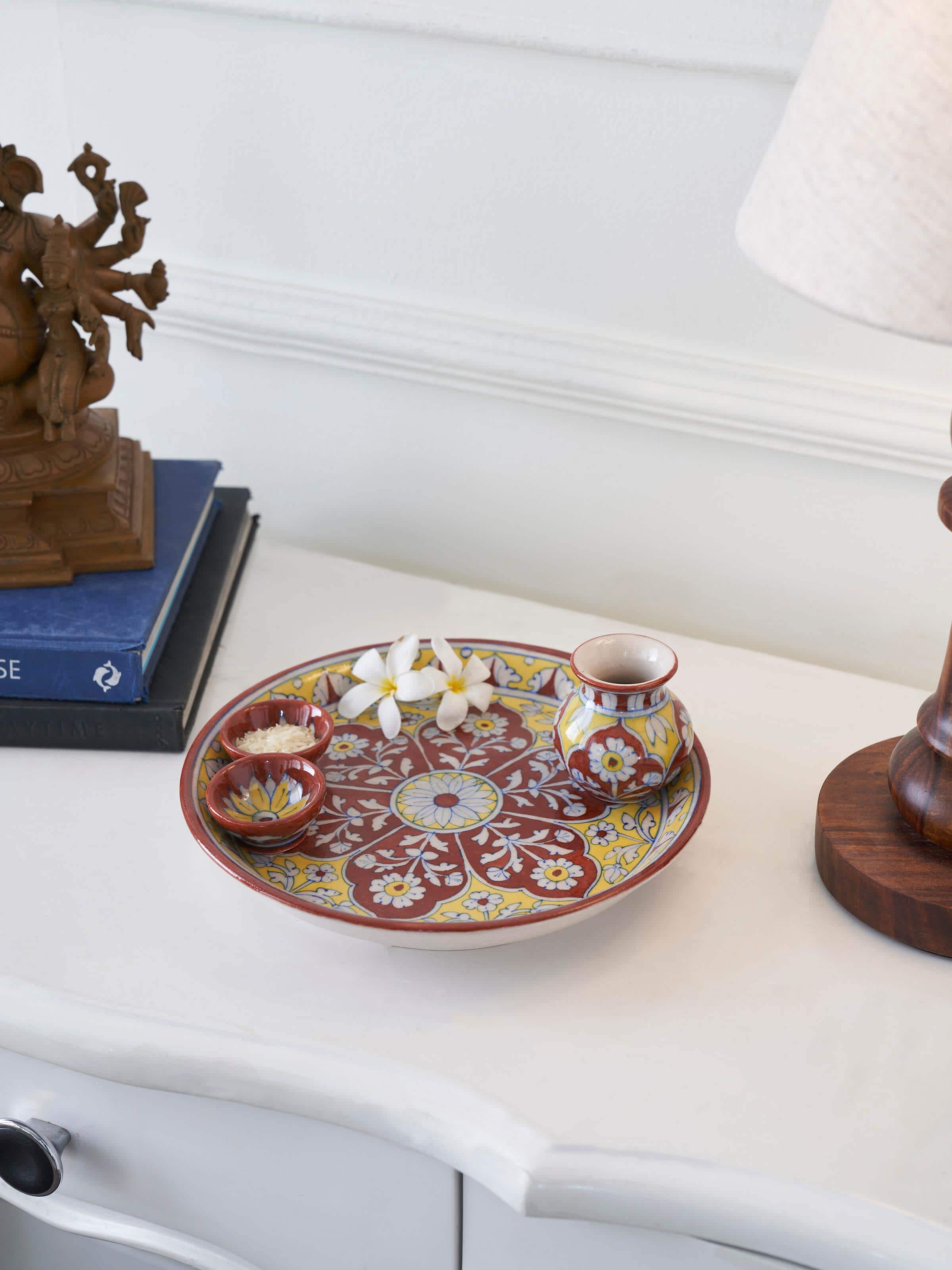Detailed view of Polished Blue Pottery Stoneware Pooja Thali Set maroon color, focusing on the decorative elements