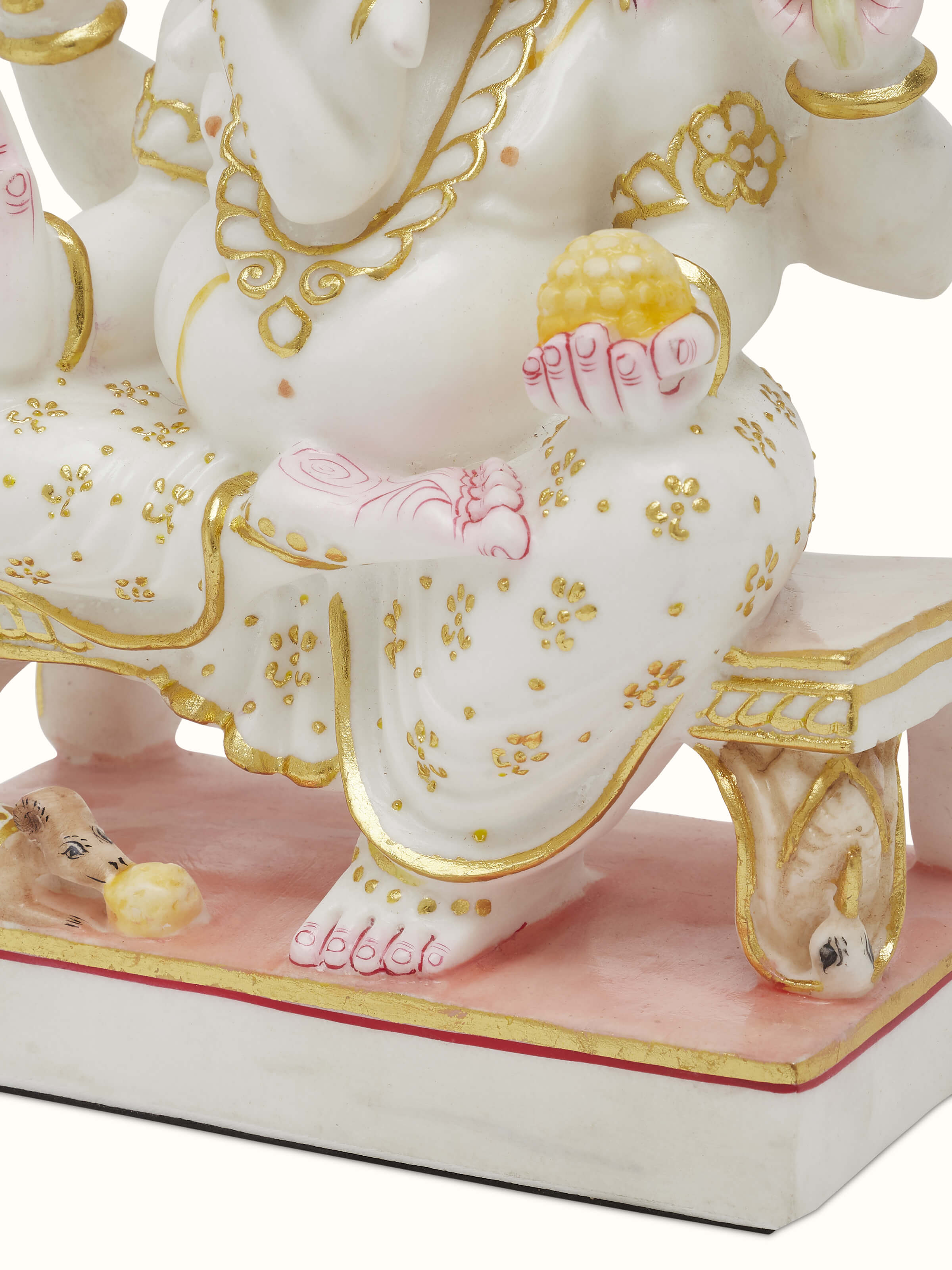 Side view of Carved Marble Ganesha Idol showing detailed carving on the profile.