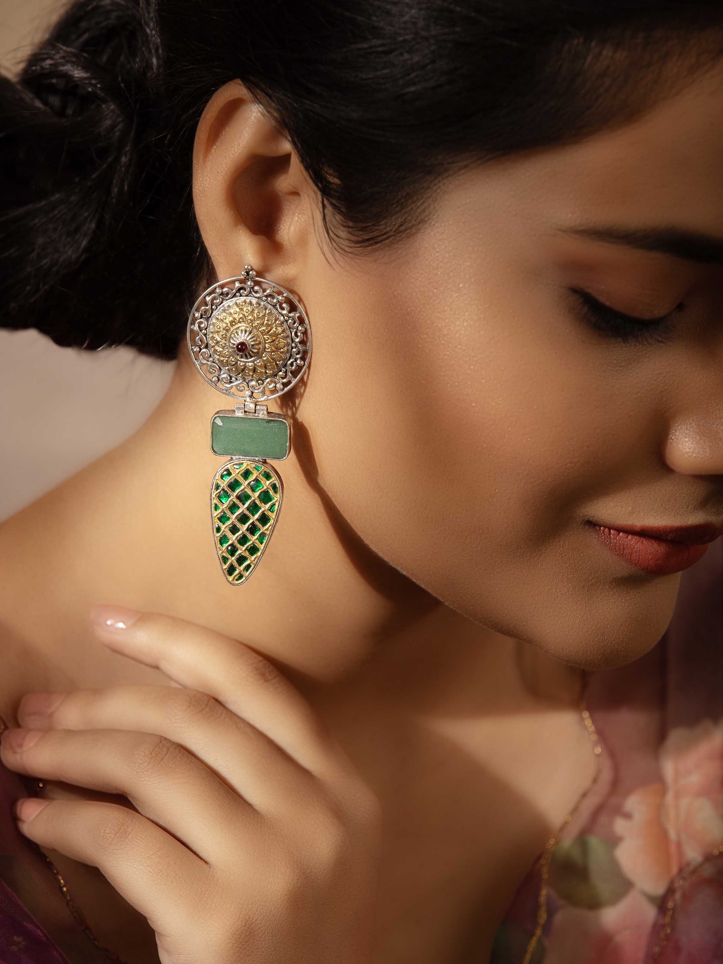 Close-up view of Silver Smithing Drop Earrings highlighting the intricate silver detailing.