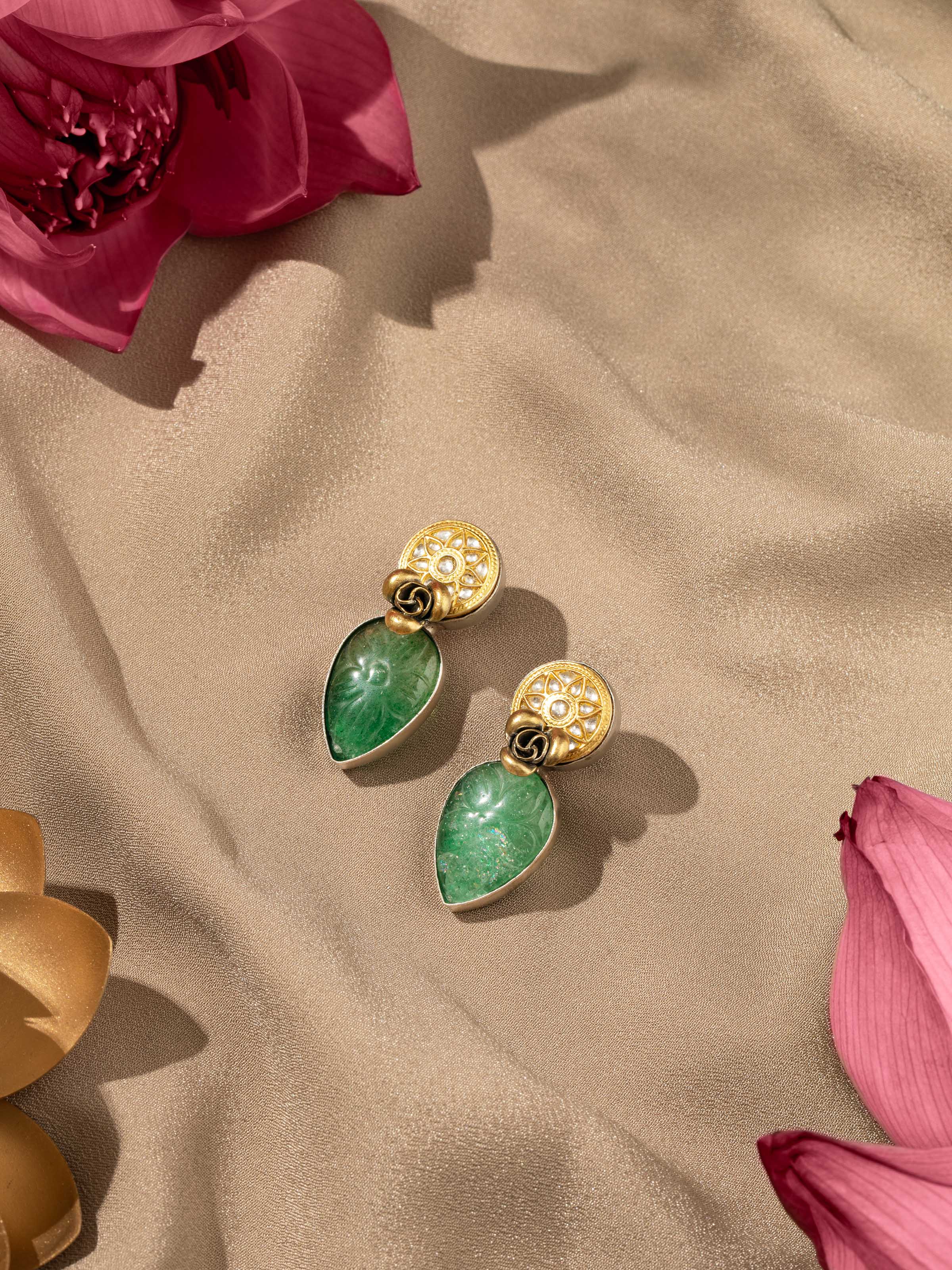 Overhead view displaying polished silver texture and stylish drop earring design