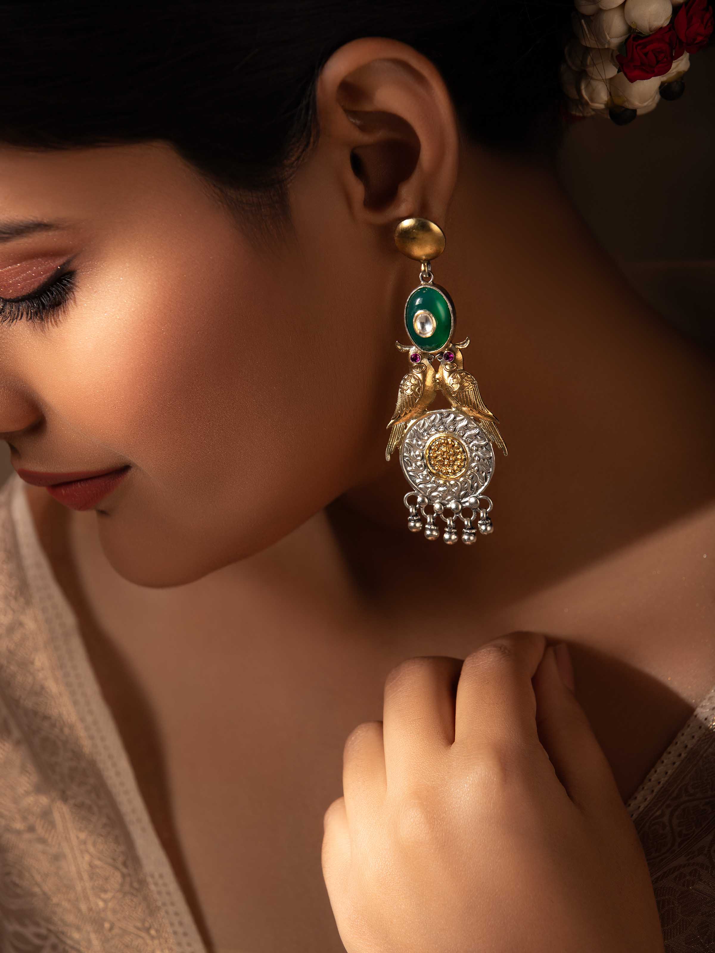 Side angle of Silver Smithing Drop Earrings by Swadesh, highlighting the graceful silhouette of the drop earrings