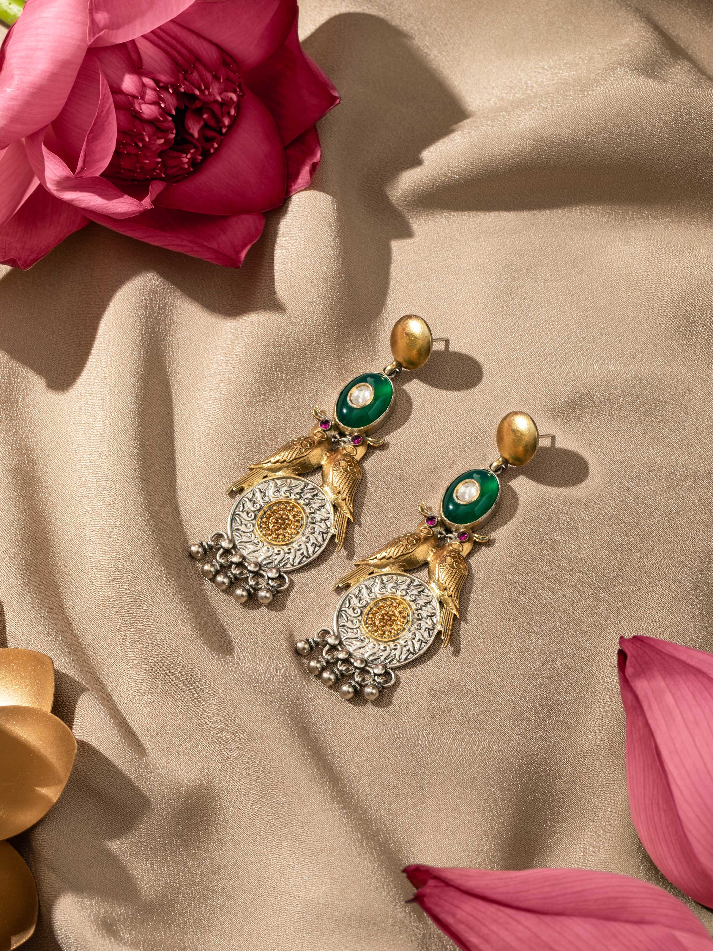 Overhead angle of Silver Smithing Drop Earrings by Swadesh, capturing the smooth curve and delicate drop design of the earrings