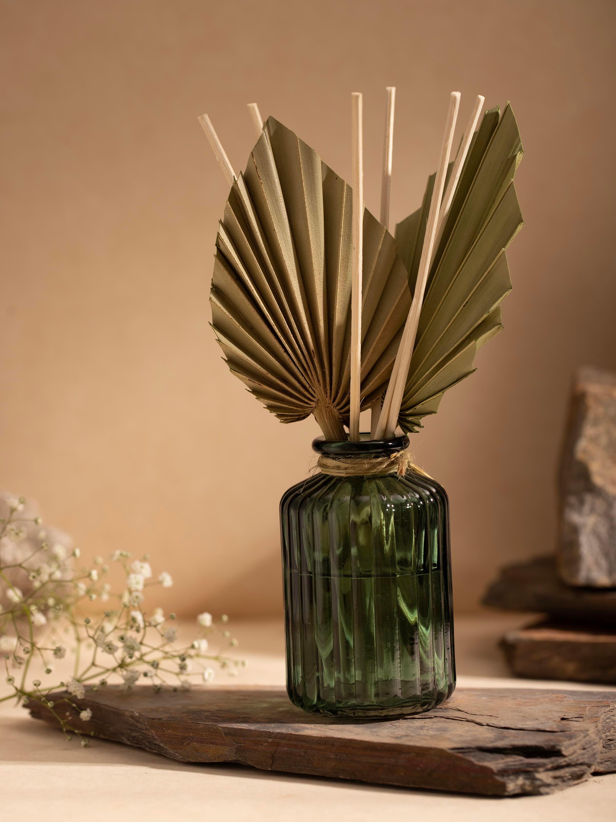Side view of Hibiscus Aroma Reed Diffuser showcasing the reed placement and label details on the glass bottle.