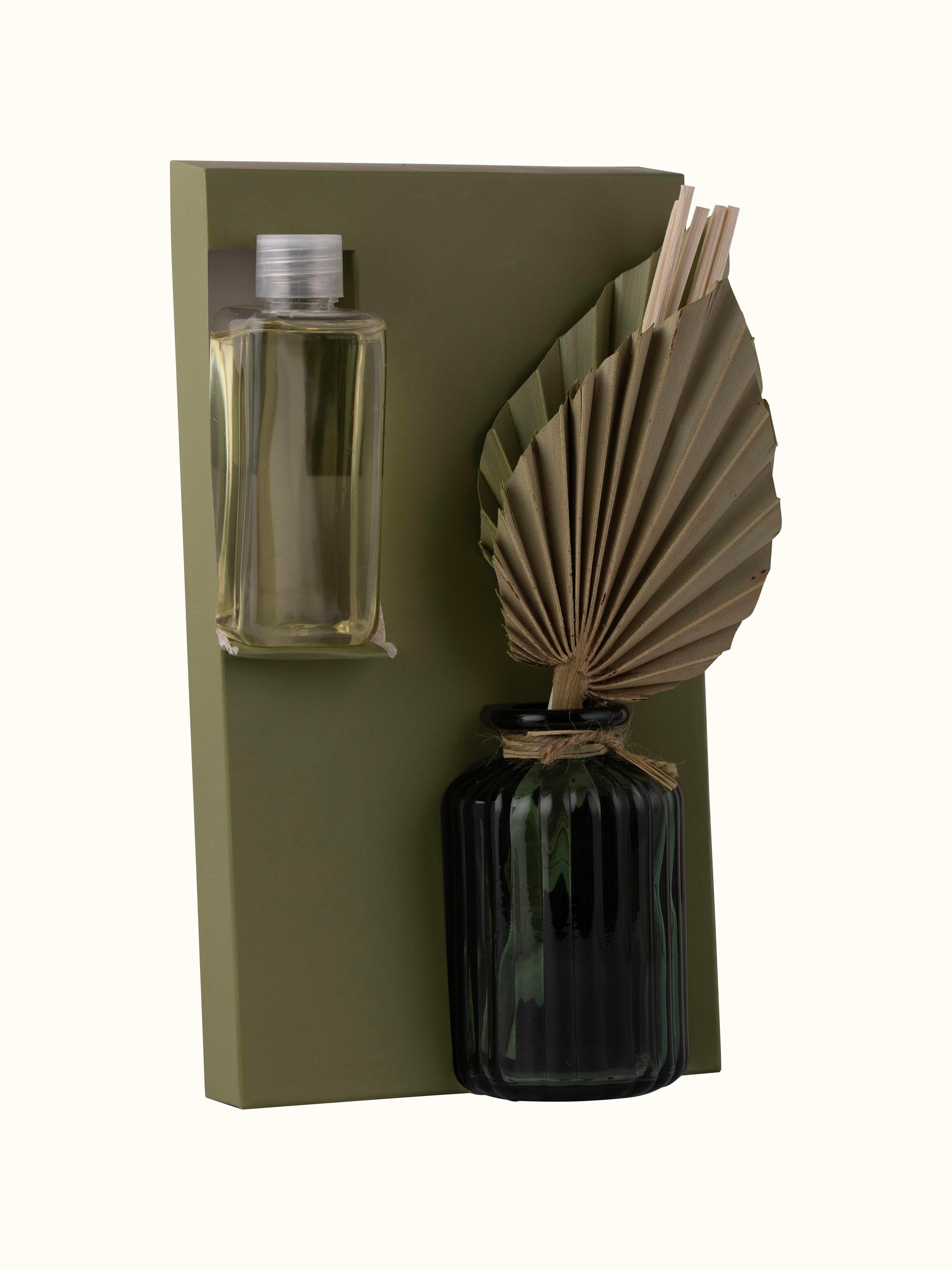 Angled view of Hibiscus Aroma Reed Diffuser showing the overall shape and design of the diffuser bottle.