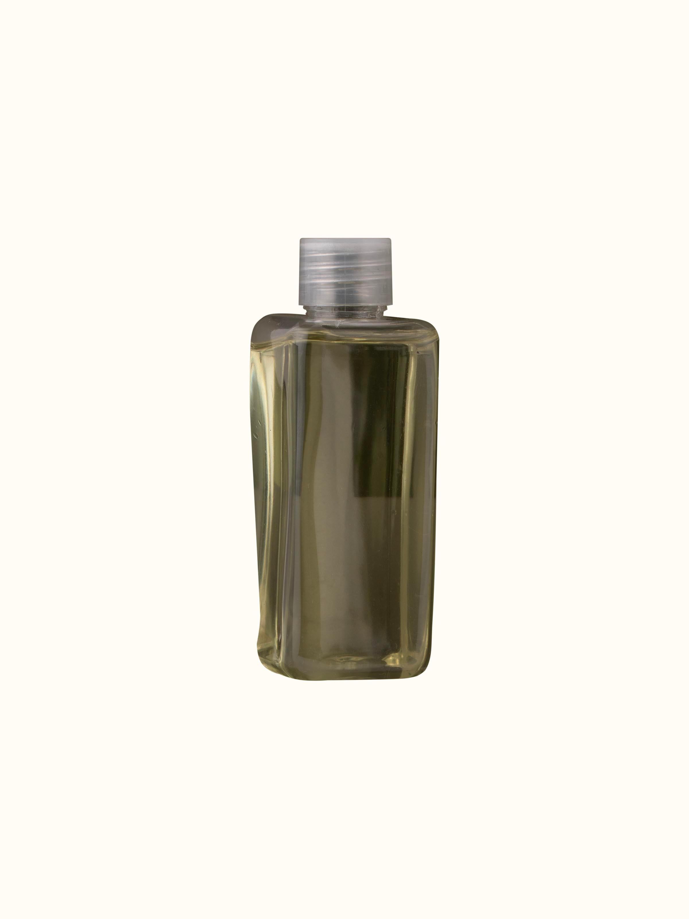 Close-up view of Hibiscus Aroma Reed Diffuser highlighting the reed sticks and elegant glass bottle design.