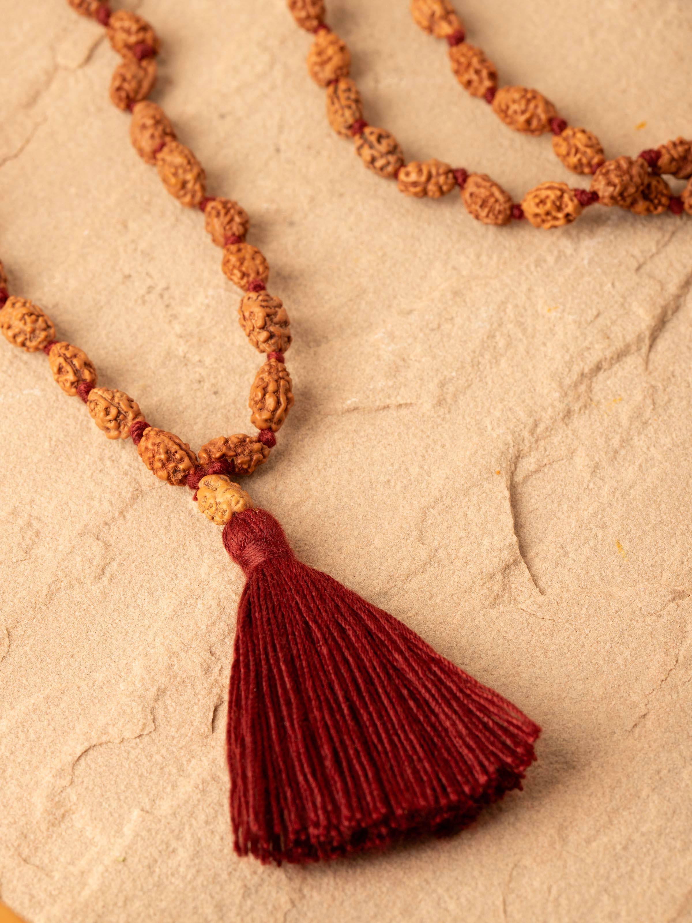 Overhead view of Dwimukhi Rudraksha Mala focusing on the overall arrangement and design of the mala.