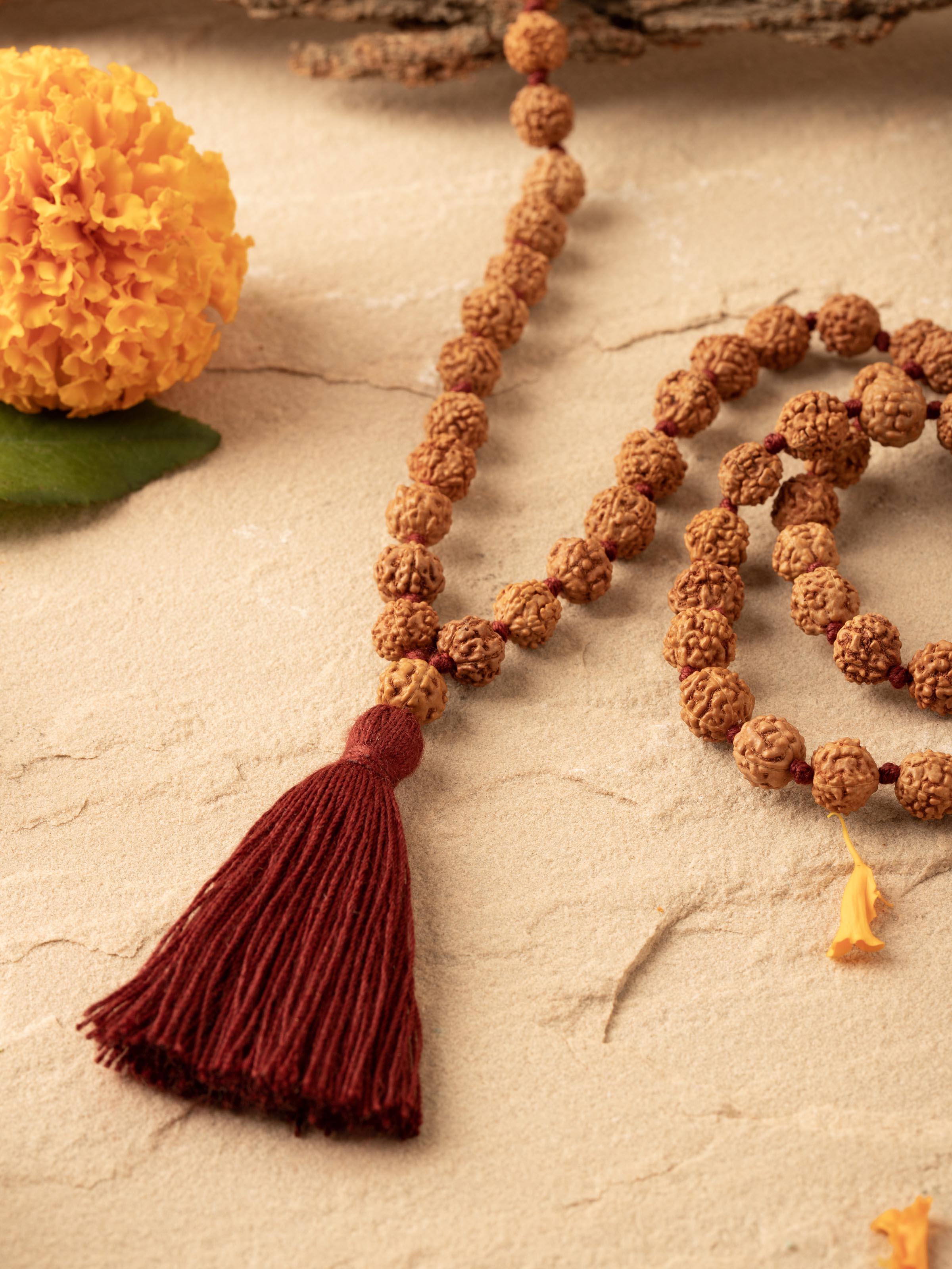 Close-up view of Khuri Panchmukhi Rudraksha Mala (4mm) showcasing the texture and natural patterns of each bead