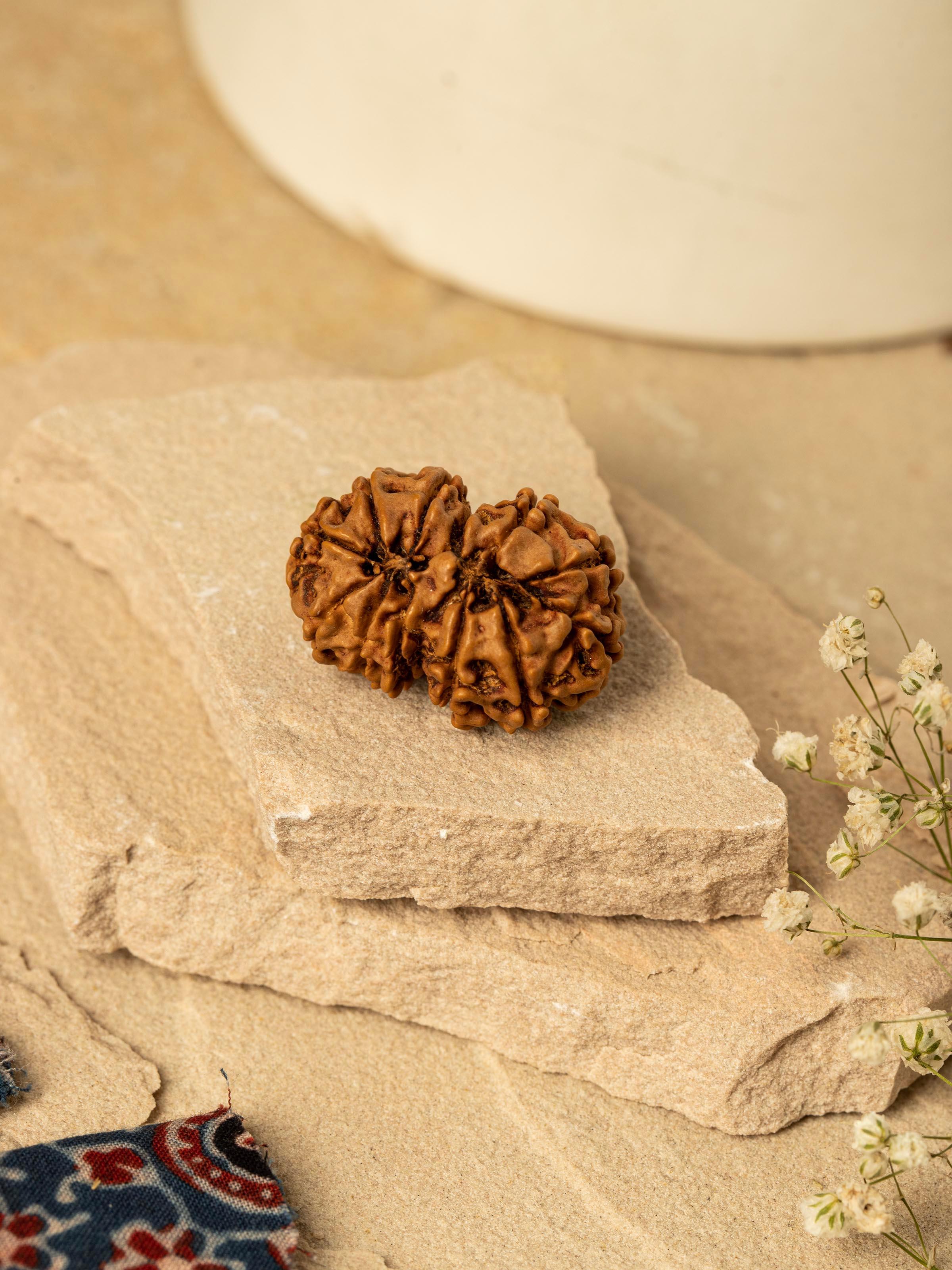 Side view of Gaurishankar Rudraksha Pendant highlighting the pendant's craftsmanship and unique shape.