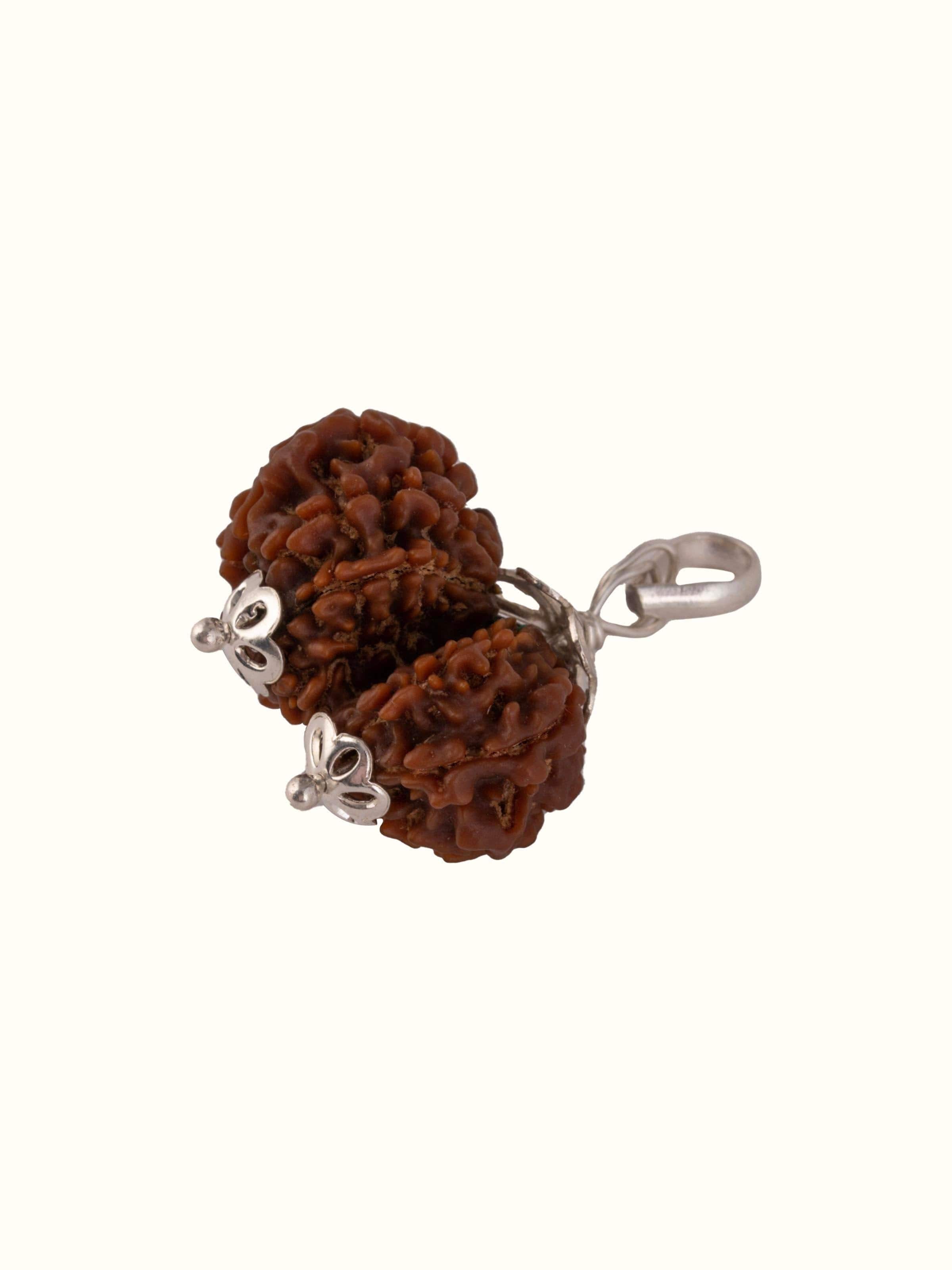 Angled view of Gaurishankar Rudraksha Sterling Silver Pendant emphasizing its unique design.