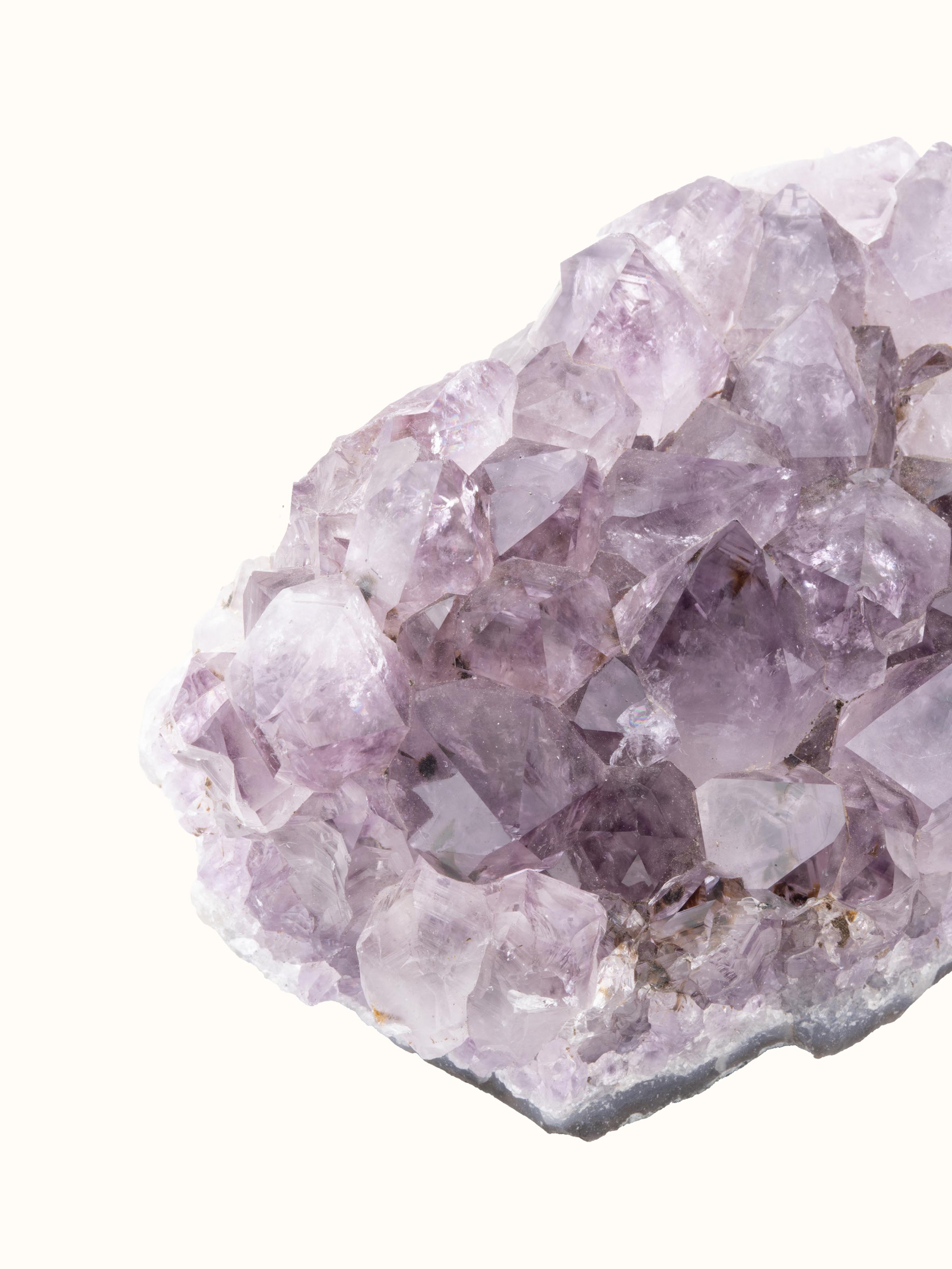 Back view of Amethyst Cluster Healing Stone revealing the base and natural rock formation of the cluster.