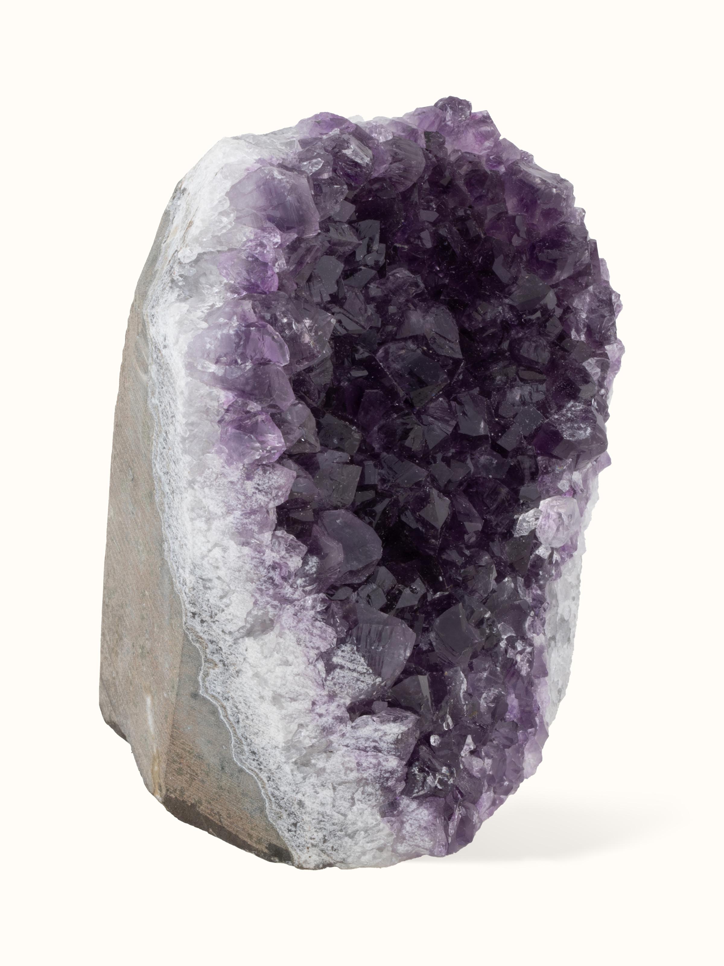 Front view of large Amethyst geode healing stone highlighting its natural crystal formations