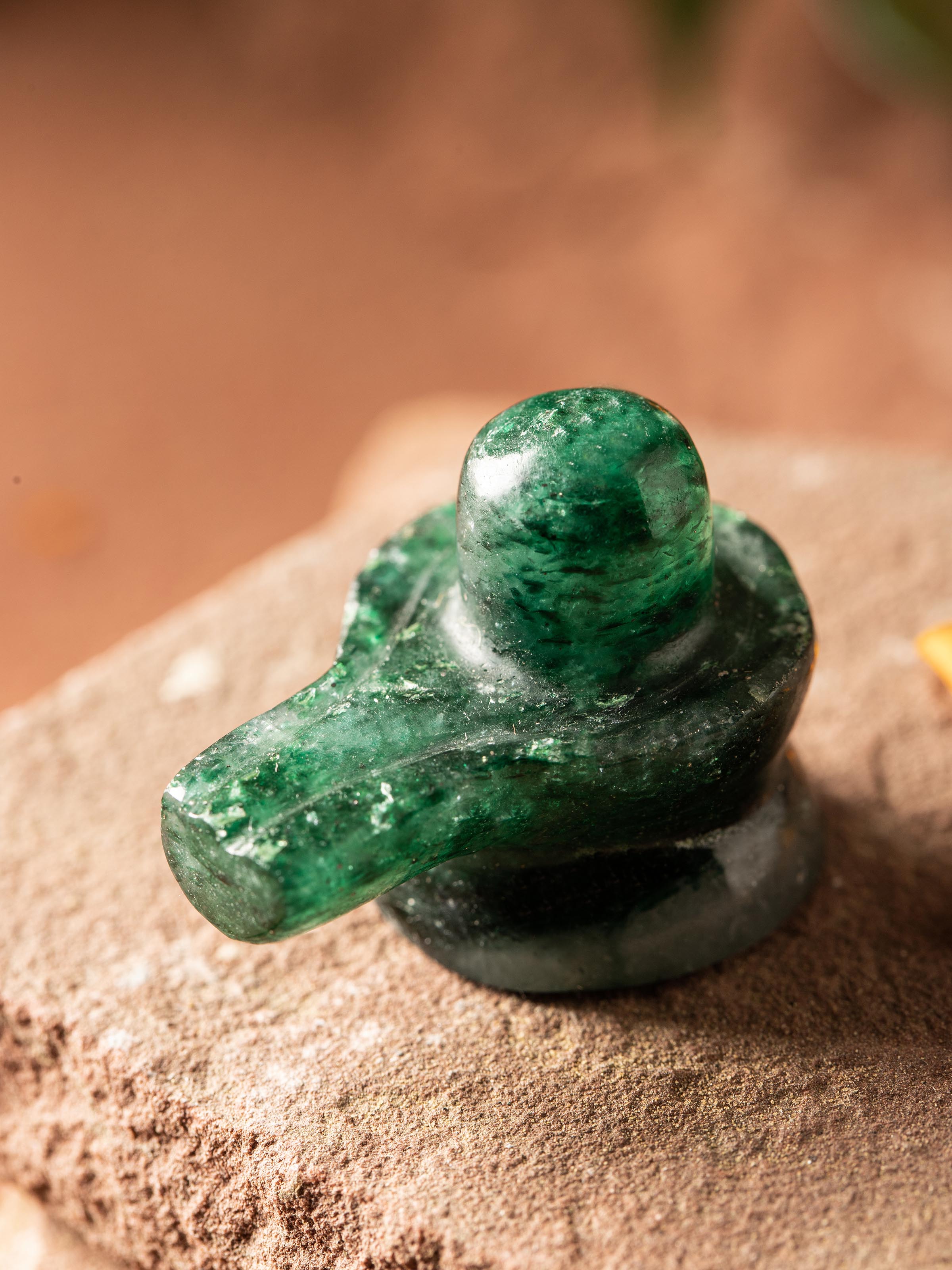 Close-up of Swadesh Small Jade Shivling, emphasizing its polished surface and natural beauty.