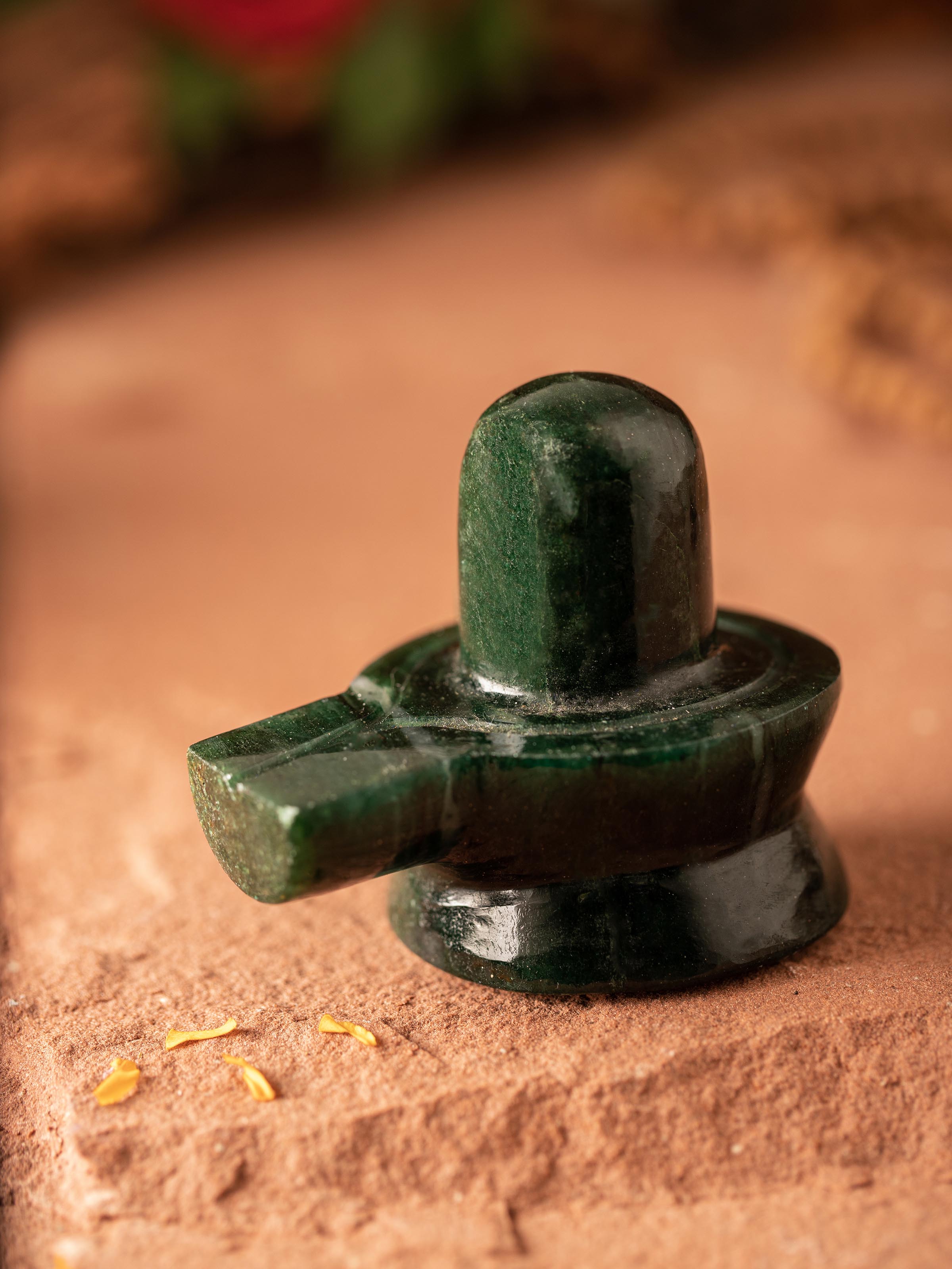 Side view of Jade Shivling (Medium) highlighting the intricate design and polished surface of the jade.