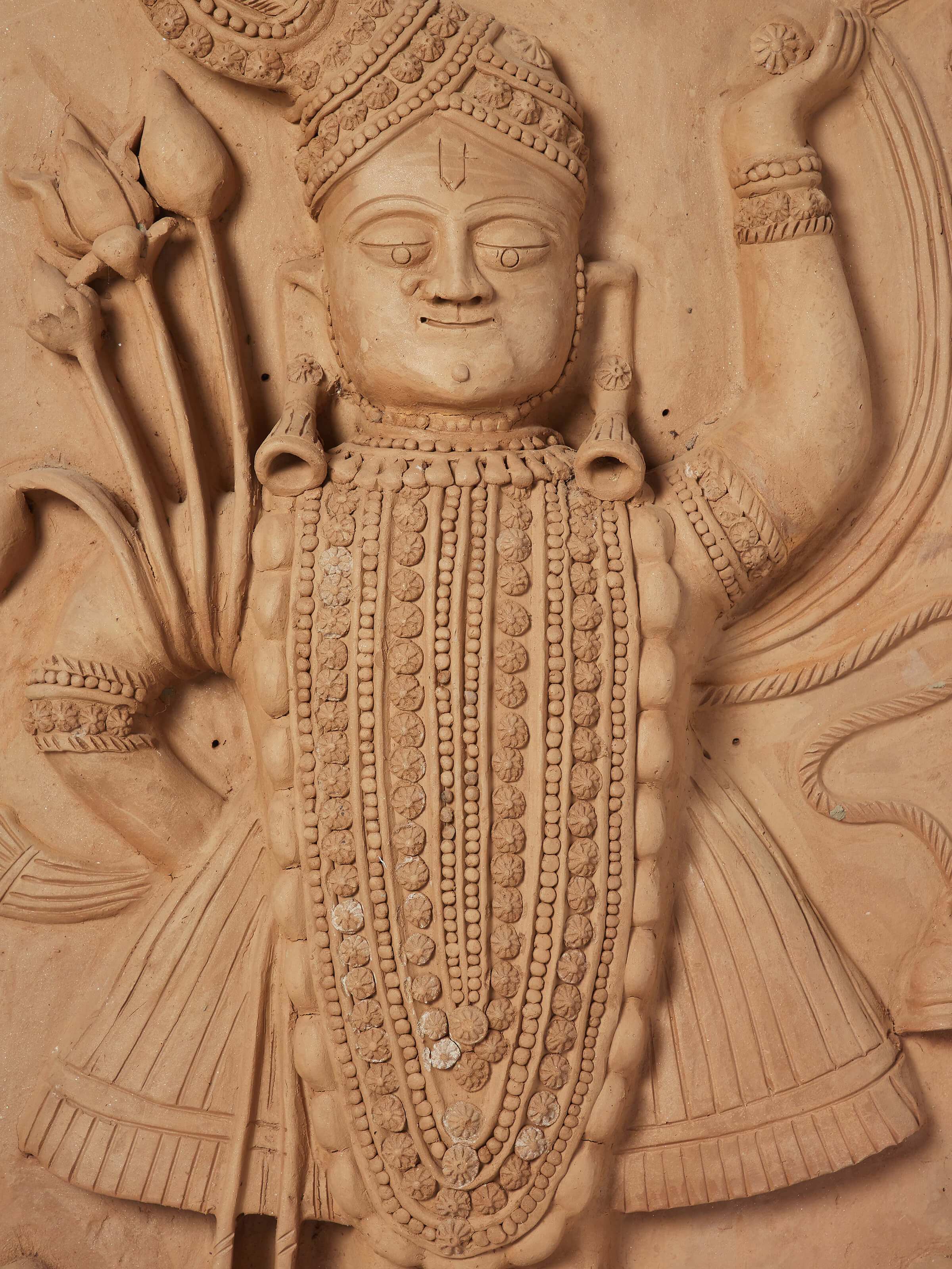 Close-up view of Terracotta clay Shreenath ji idol highlighting the fine details and traditional terracotta work