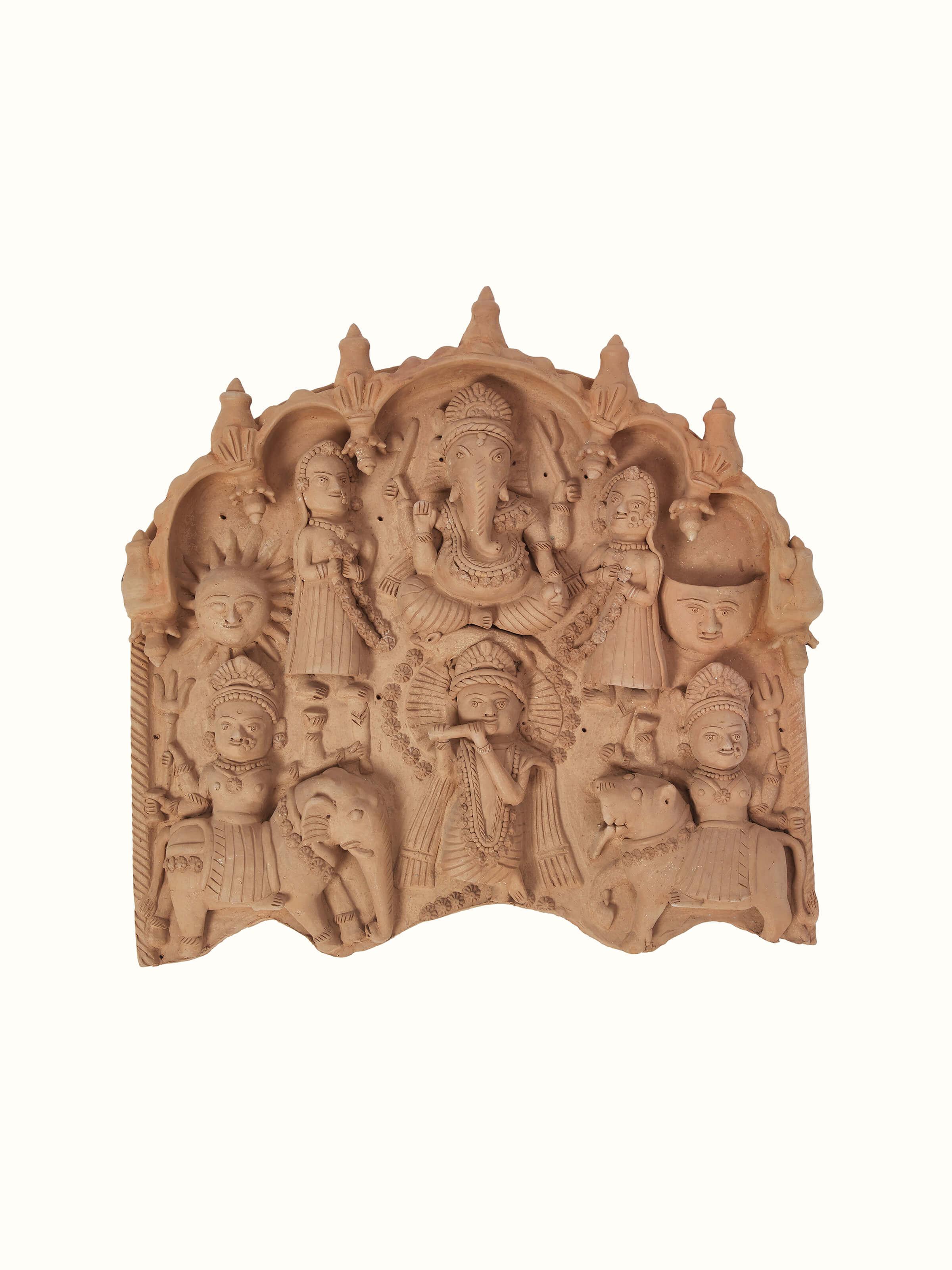 Angled view of Terracotta clay Krishna story idol highlighting the detailed sculpture and vibrant terracotta finish