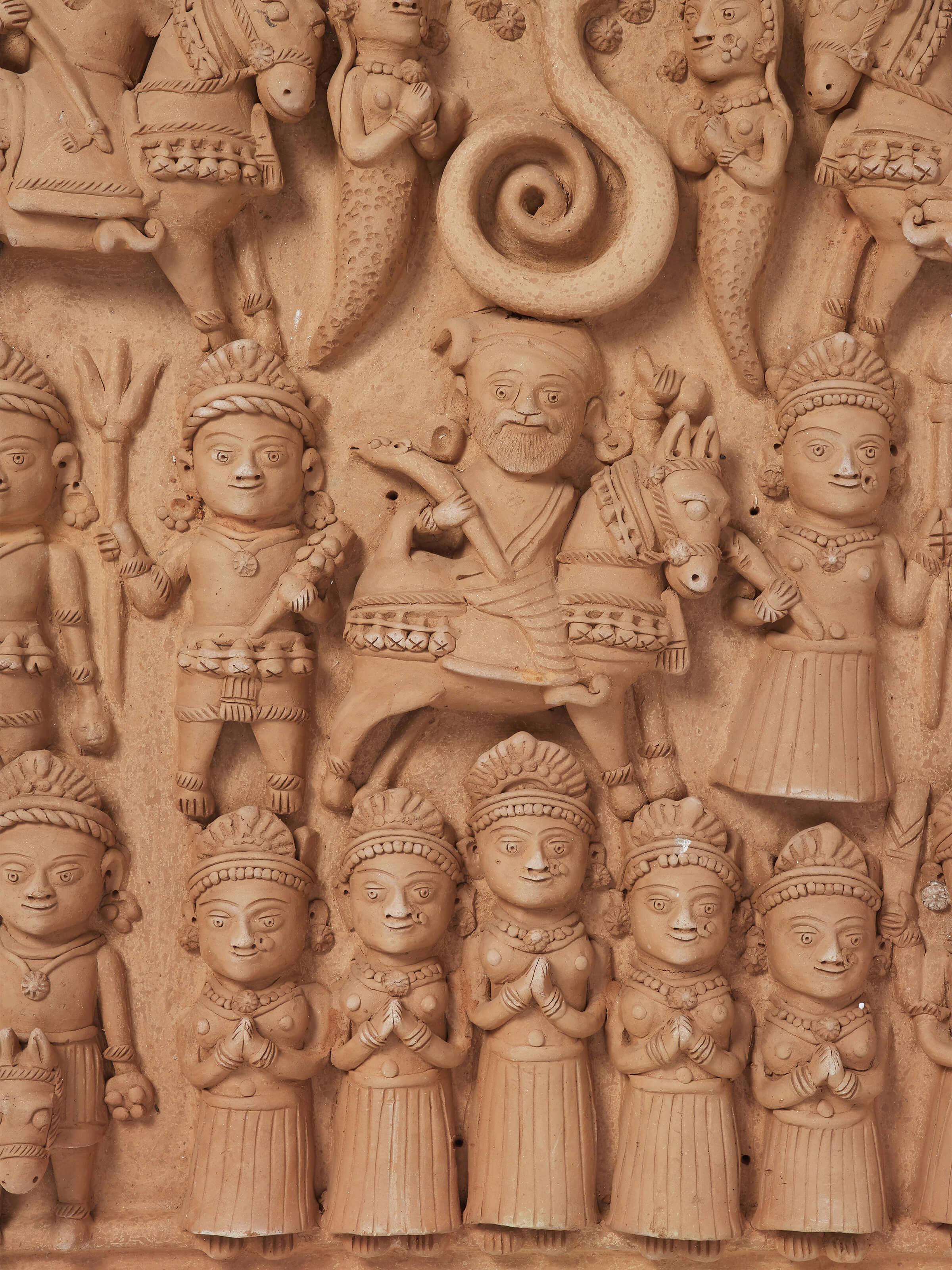 Detailed view of Terracotta clay Krishna story idol focusing on the craftsmanship and storytelling elements