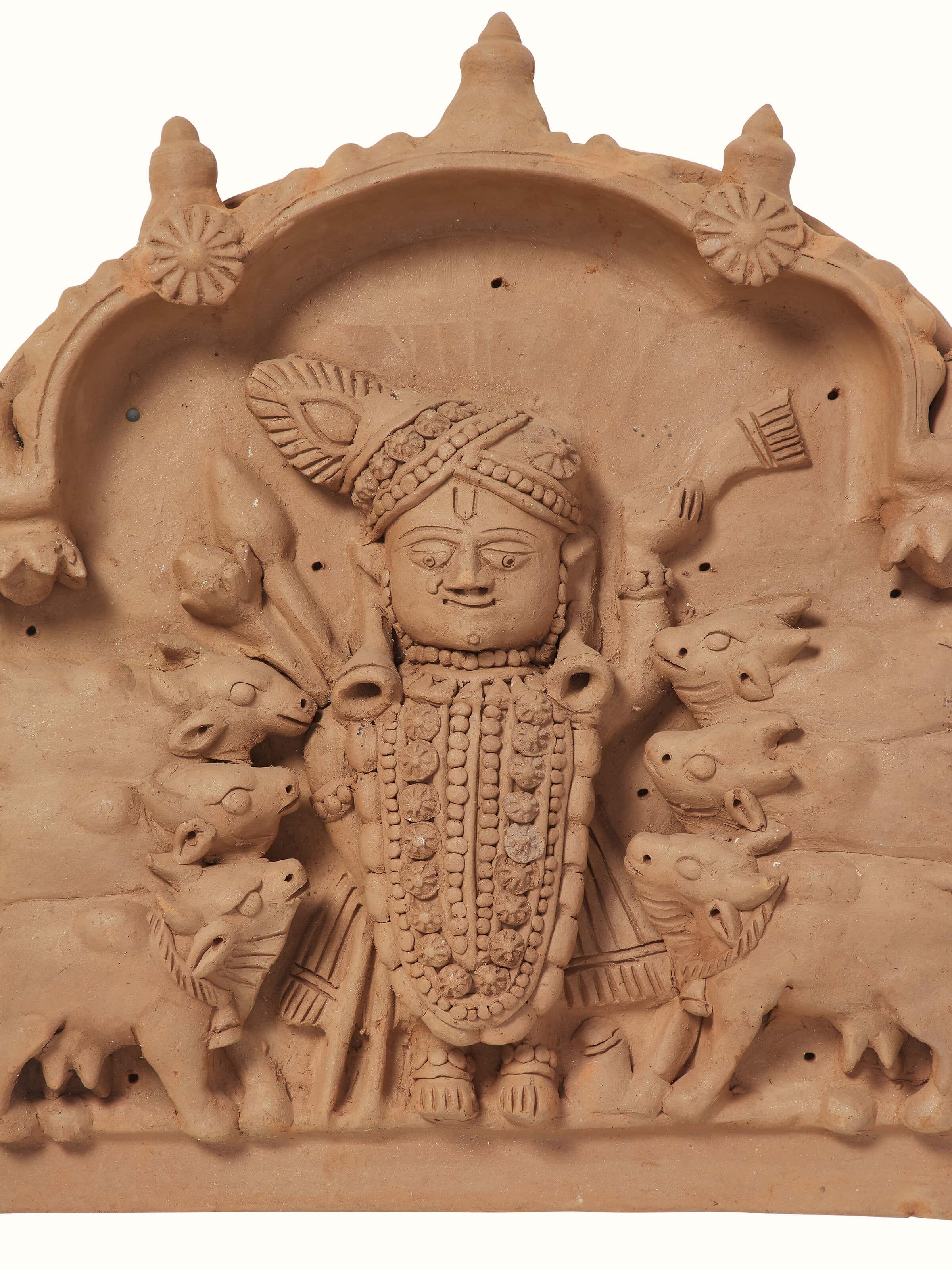 Side view of Terracotta clay Shreenath ji with cows idol showcasing detailed sculptural work
