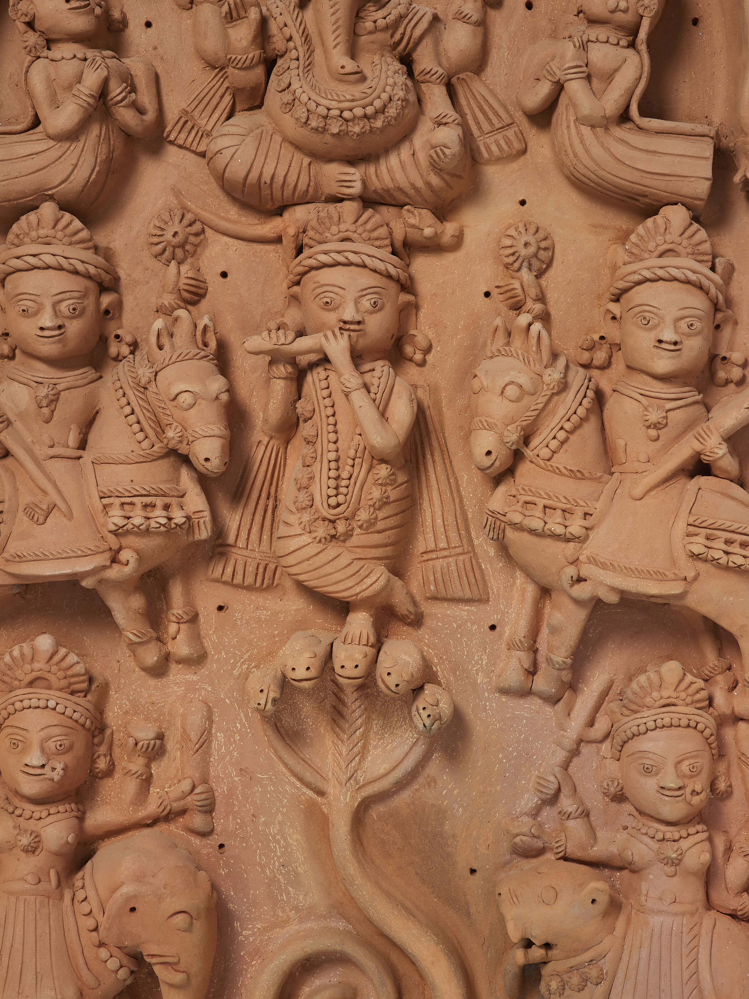 Angled view of Terracotta Clay Ganesha Idol displaying its overall design and craftsmanship.