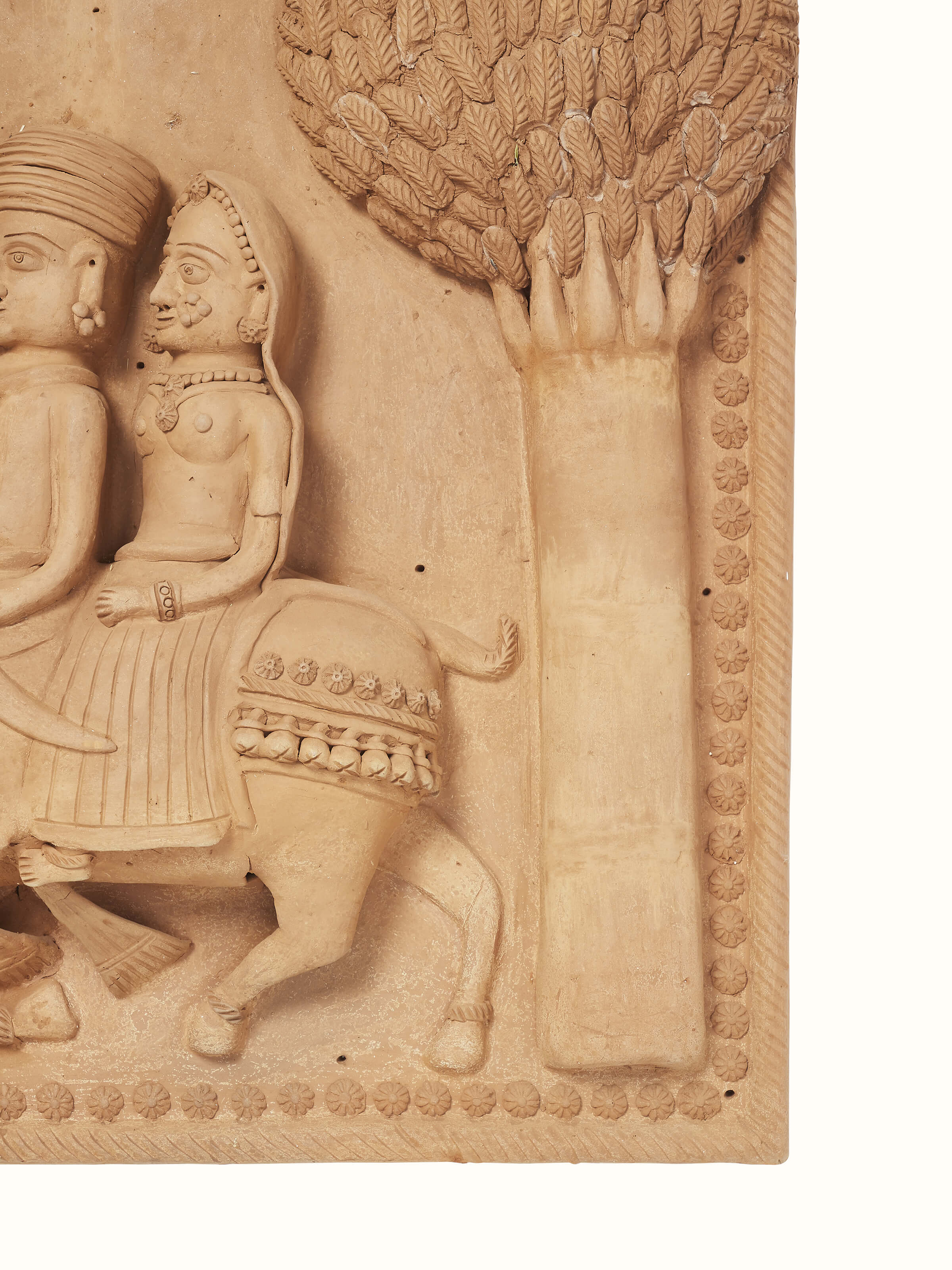 Detailed view of Terracotta clay Dhola Maru sculpture focusing on texture