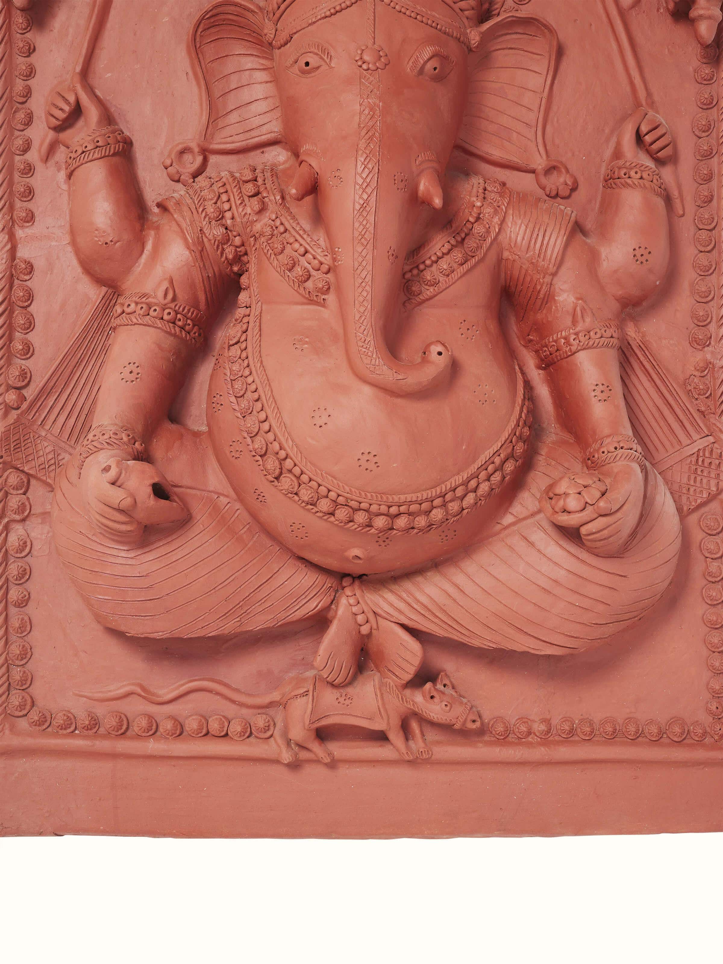 Side view of terracotta clay Ganesha idol, showcasing its artistic design and traditional features.