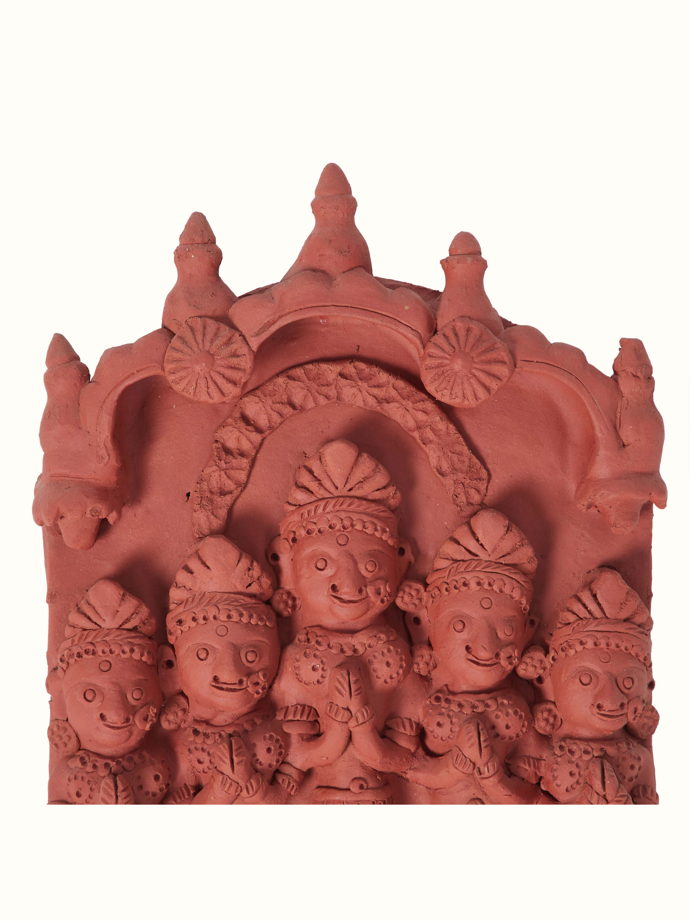 Close-up of terracotta clay five lords sculpture, highlighting intricate details and traditional artistry.