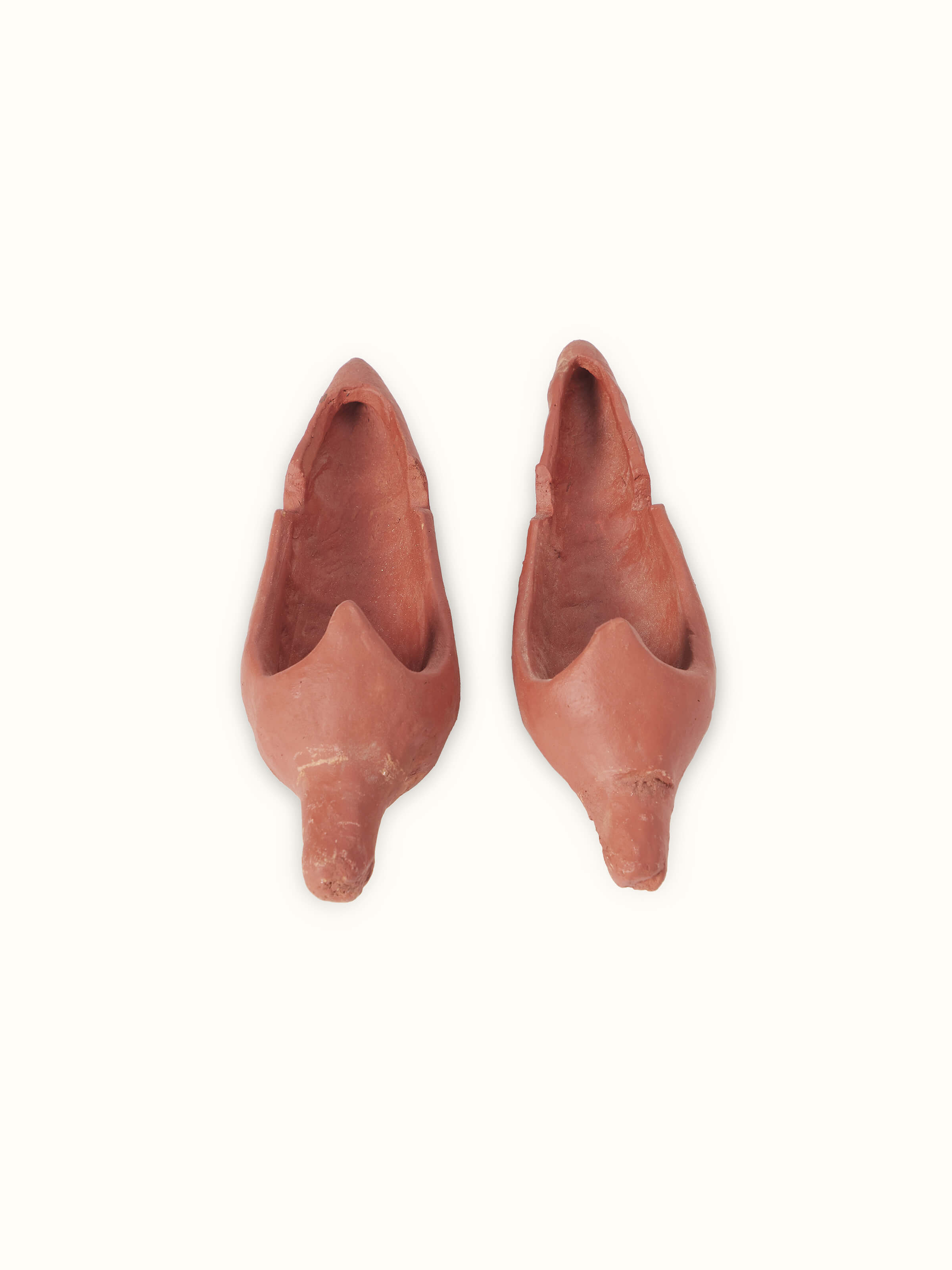 Side profile of Terracotta clay horse sculpture highlighting artistic details and robust design.