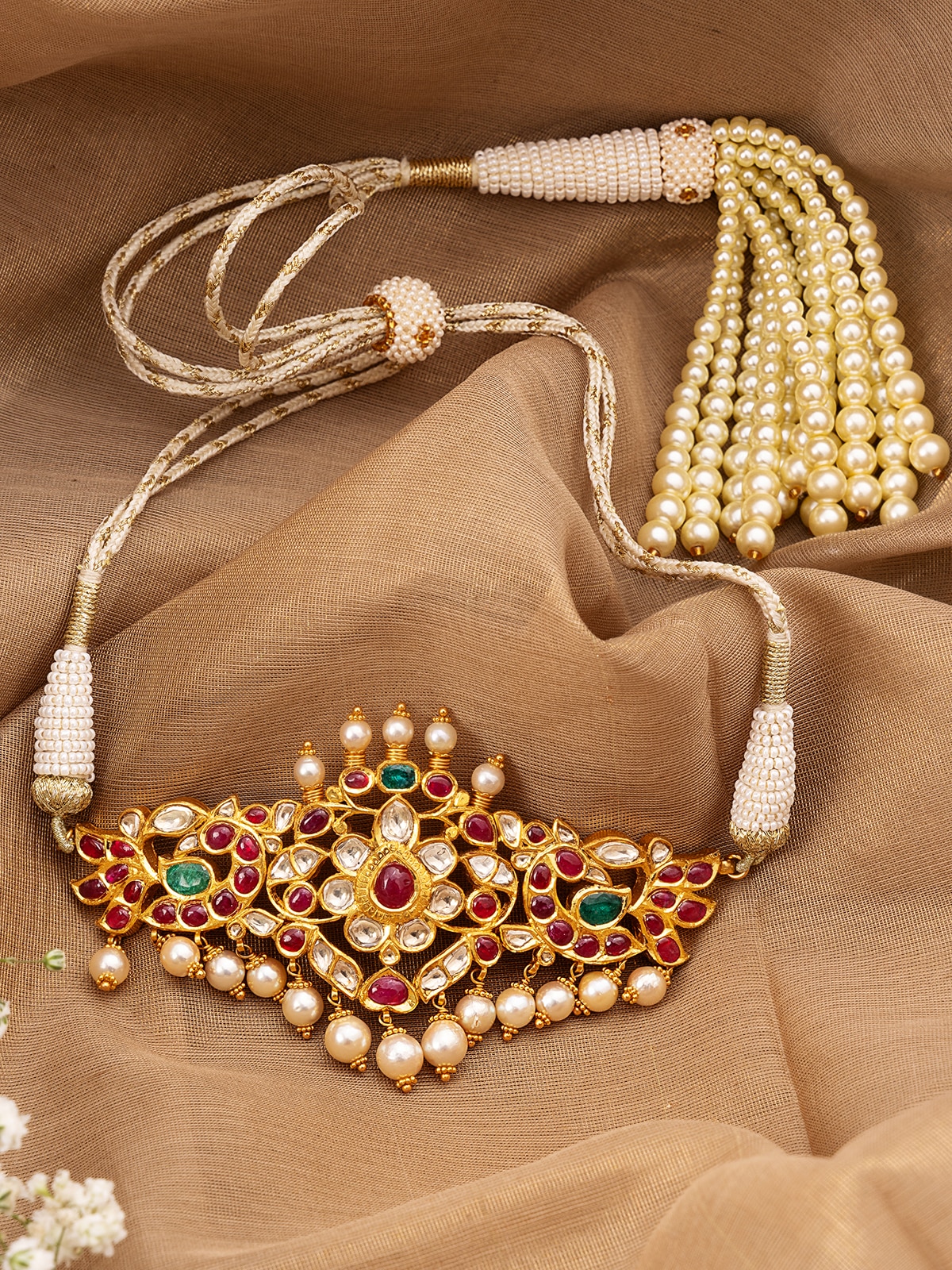 Overhead view of Hyderabad Jadau 22 Karat Gold Choker emphasizing the detailed goldwork and design.