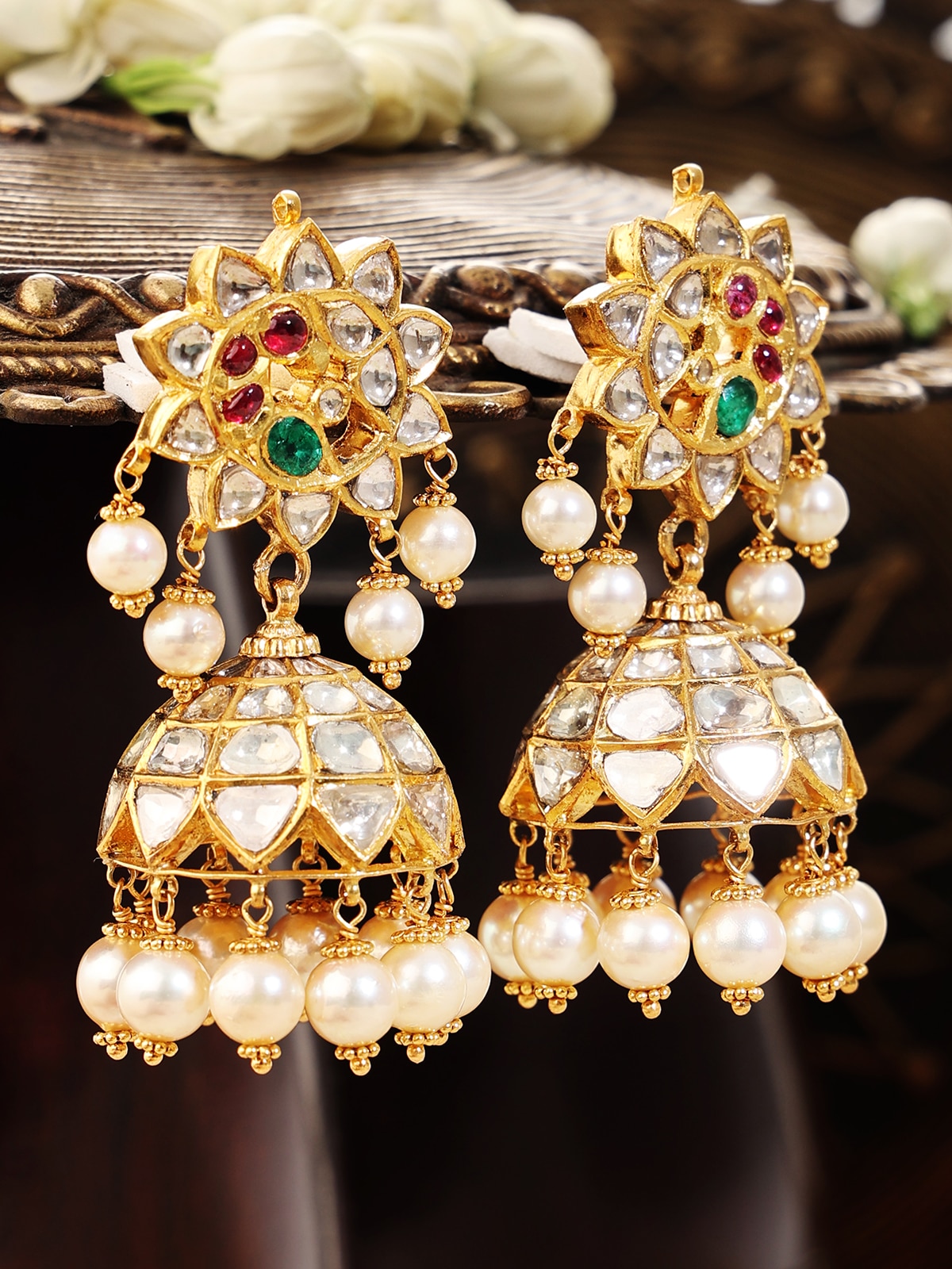 Side view of Hyderabad Jadau 22 karat gold drop earrings highlighting their detailed design