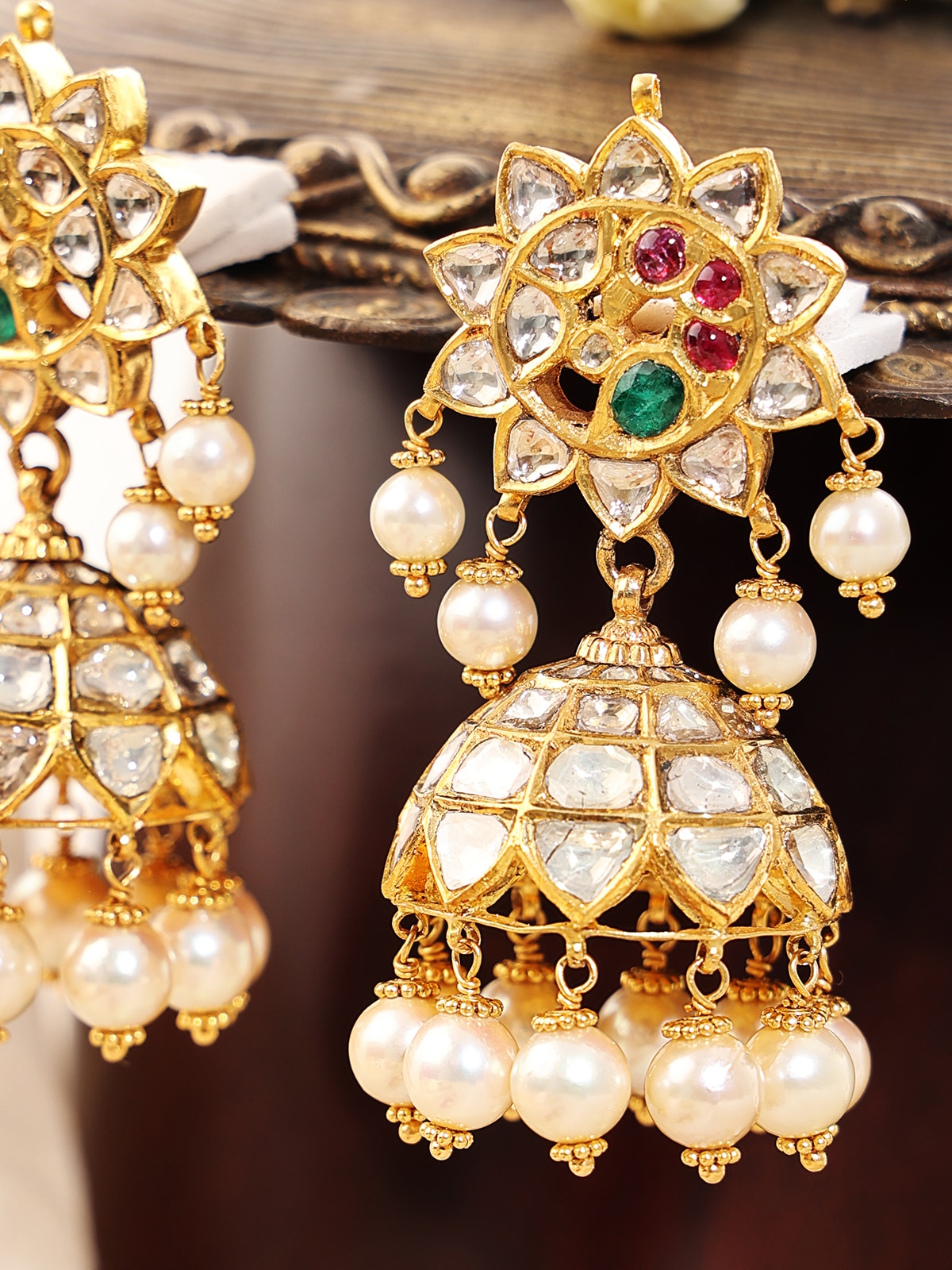 Detailed front view of Hyderabad Jadau 22 karat gold drop earrings highlighting exquisite goldwork