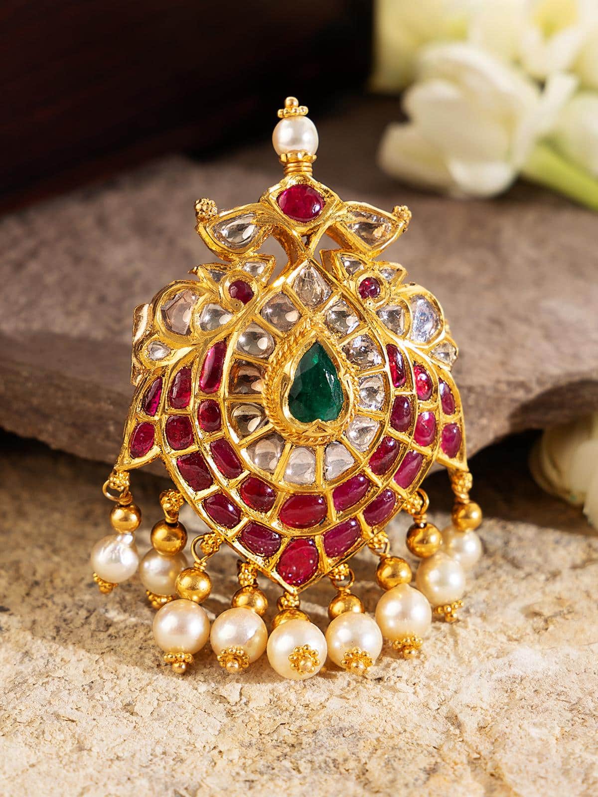 Side view of Hyderabad Jadau brooch pin with elegant floral pattern and rich texture