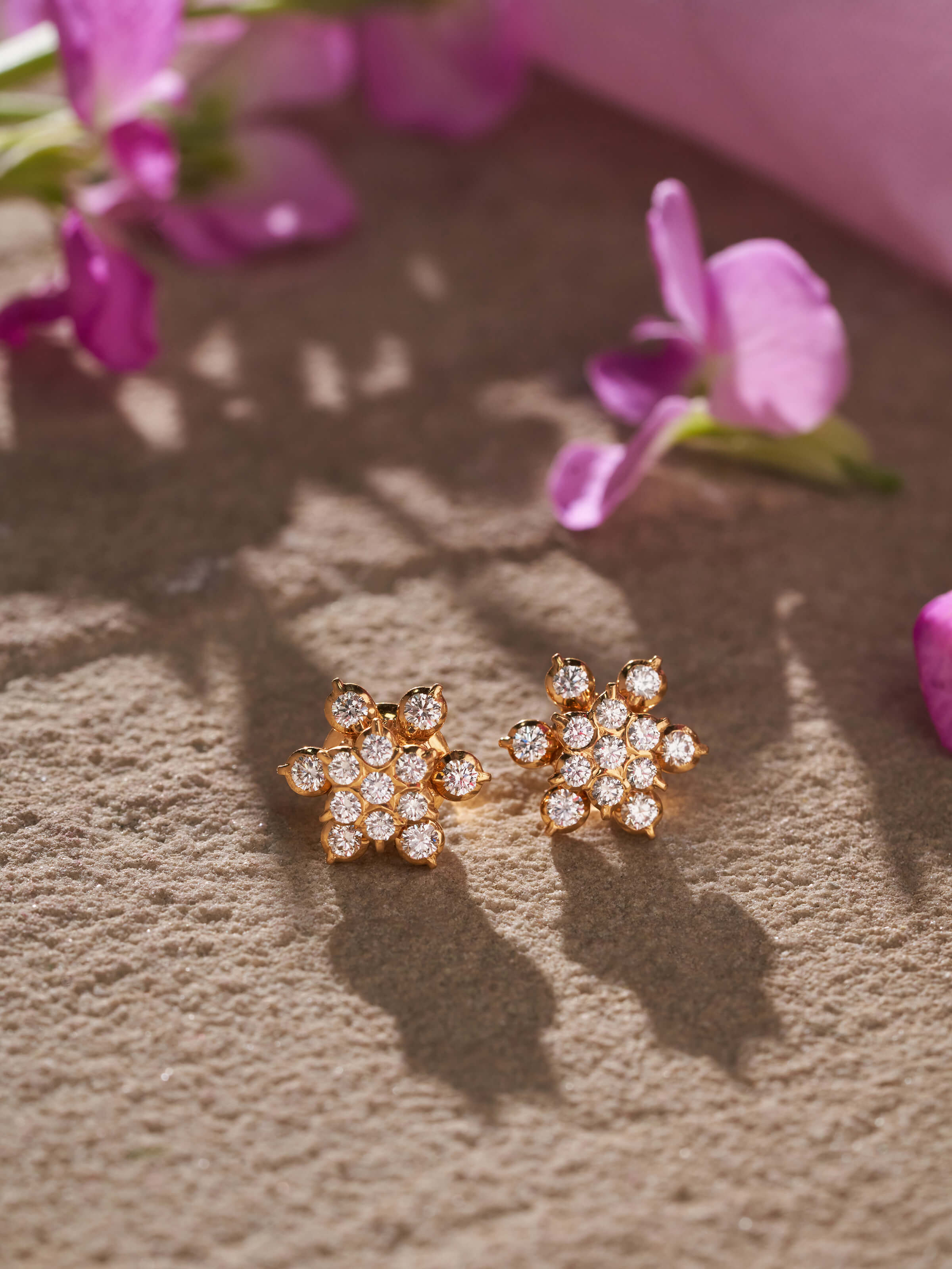 Alternate front view of gold studs showcasing classic style with sleek edges