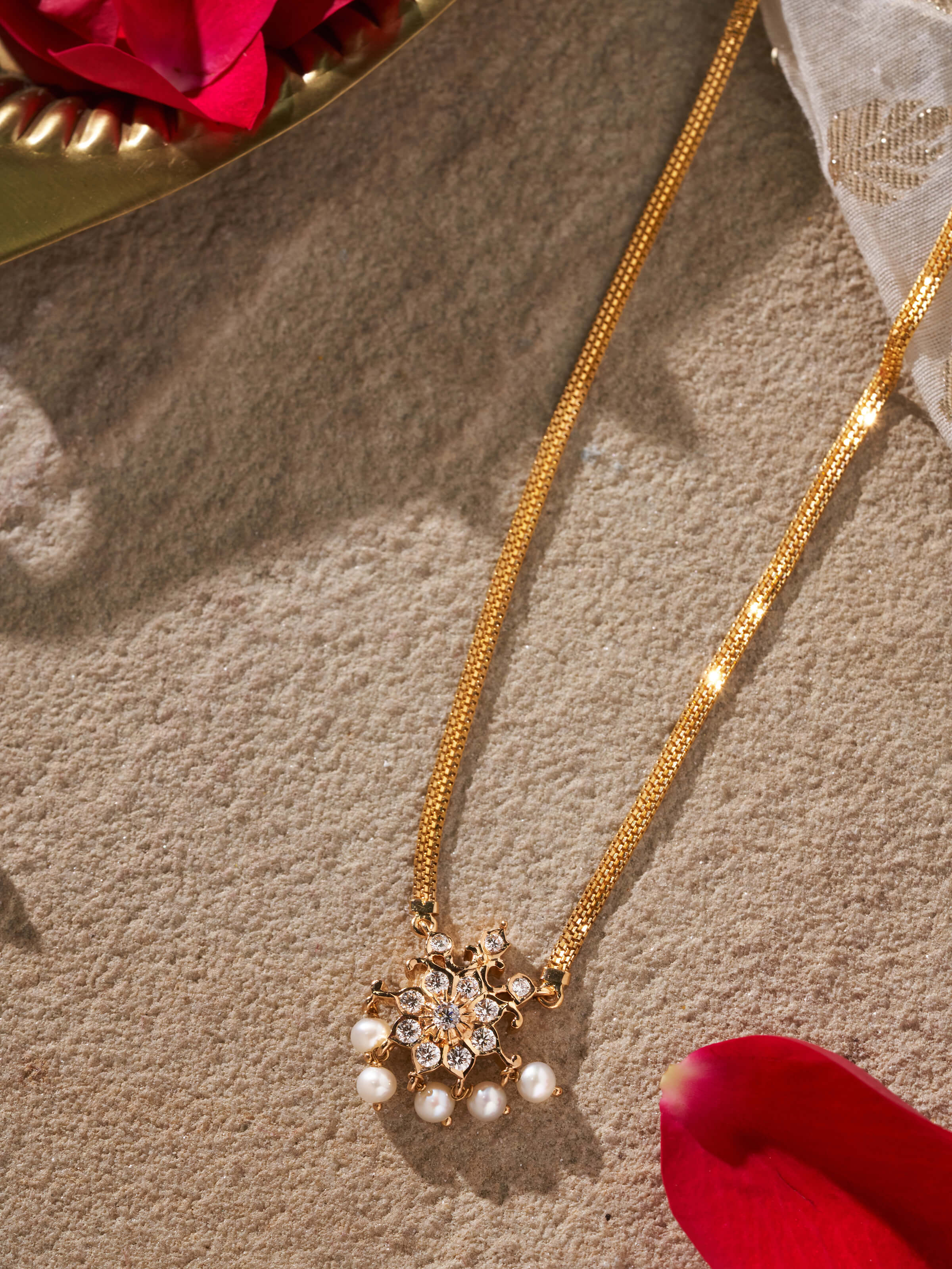 Side angle highlighting the detailed craftsmanship of the pendant
