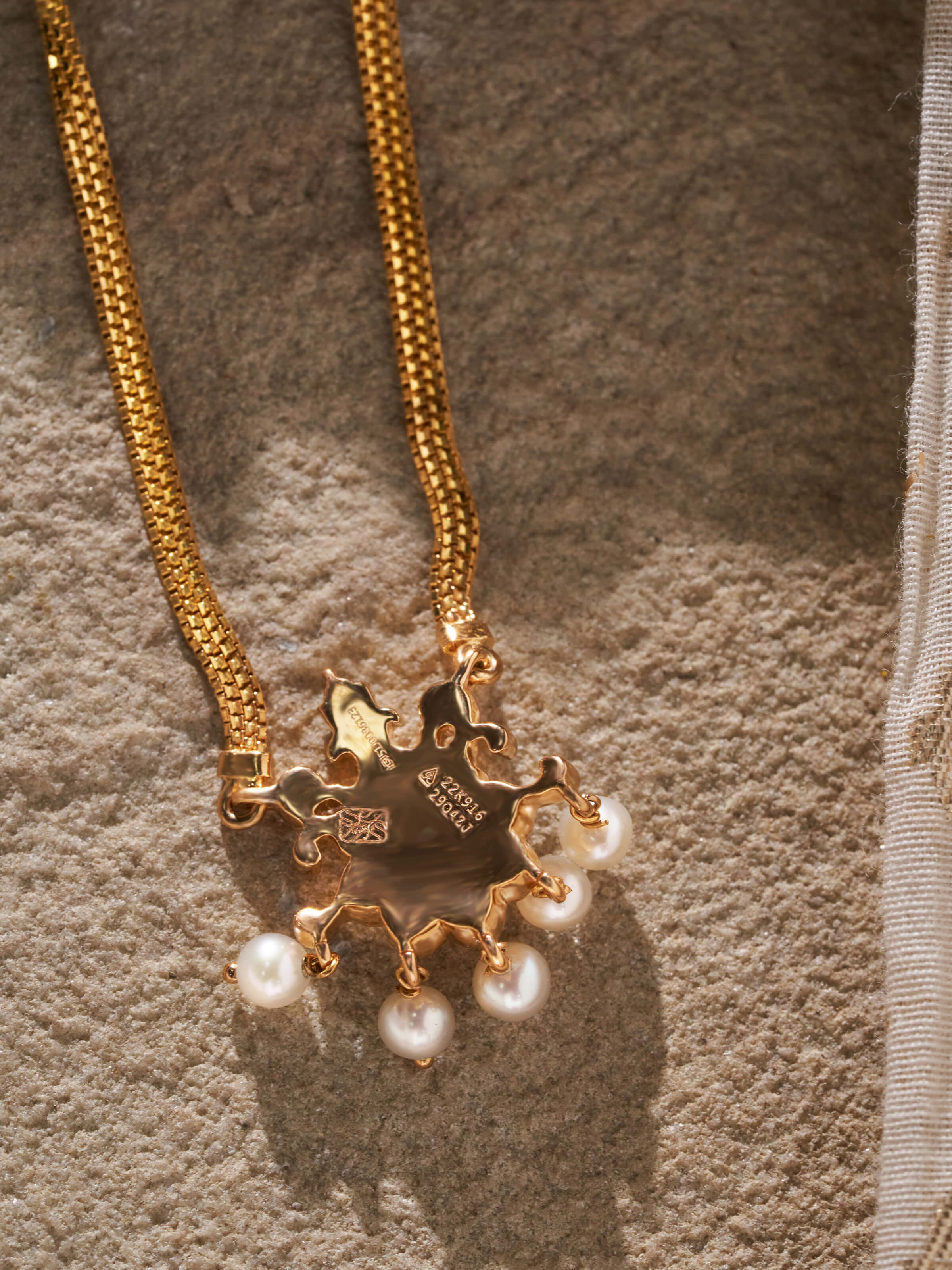 Angled shot emphasizing the pendant’s fine design and polish