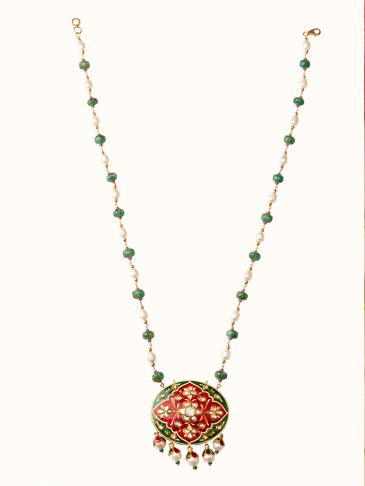 Angled view of Meenakari 22 karat gold pendant & chain showcasing colorful enamel work and elegant design