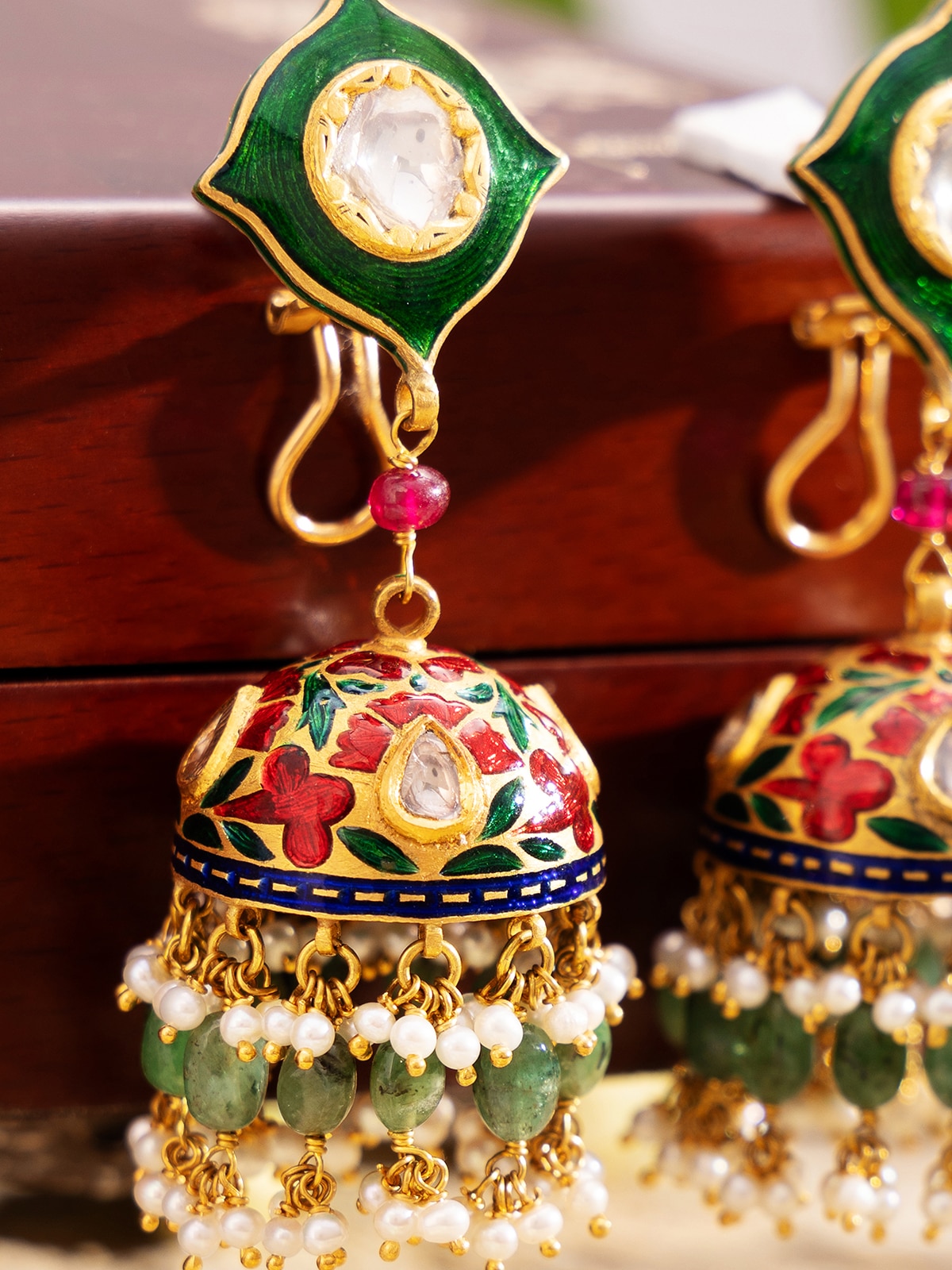 Detailed view of Meenakari 22 Karat Gold Jhumkas focusing on the intricate patterns and high-quality gold finish