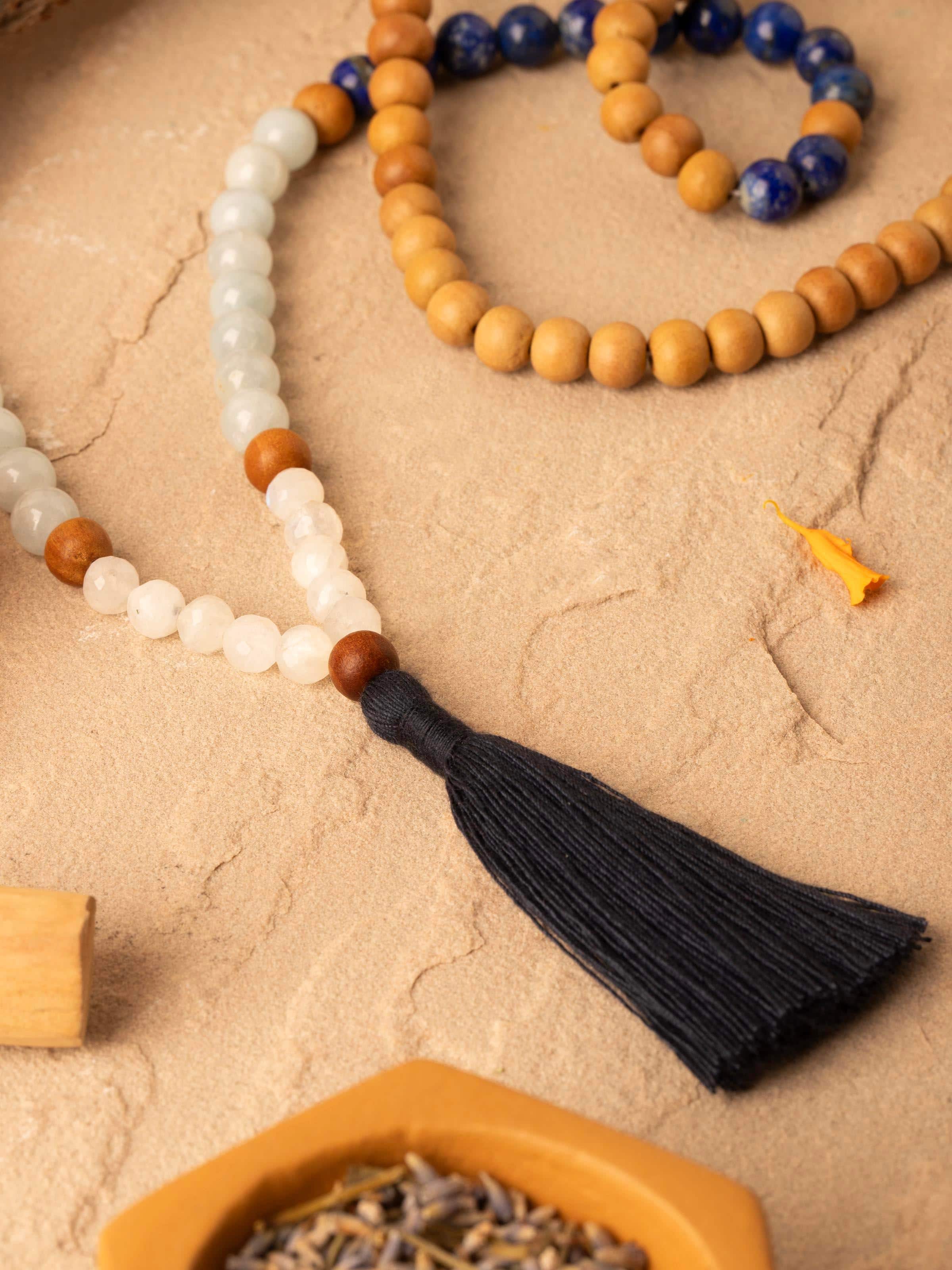 Side view of Lapis Lazuli, Aquamarine & White Moonstone Mala highlighting the intricate beadwork and design.