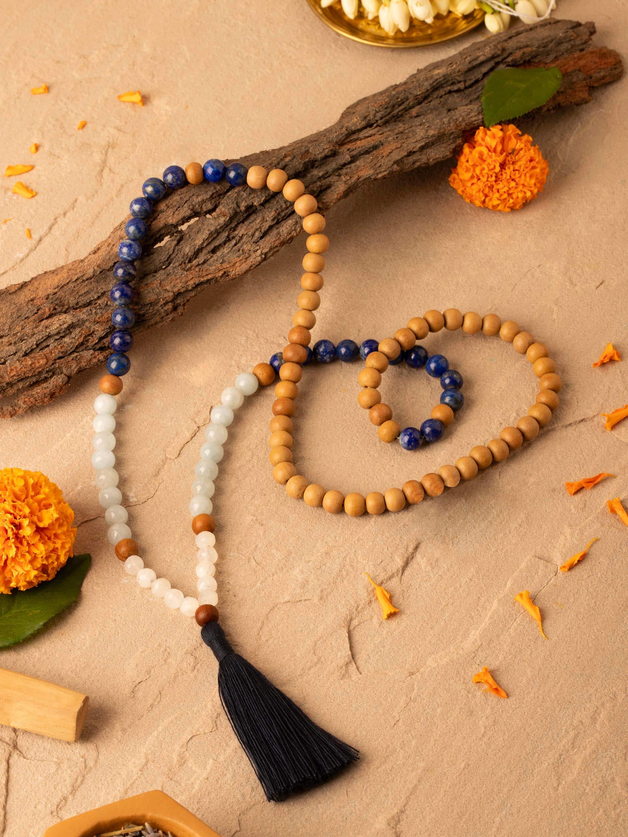 Close-up of Lapis Lazuli, Aquamarine & White Moonstone Mala focusing on the texture and color contrast of the beads.