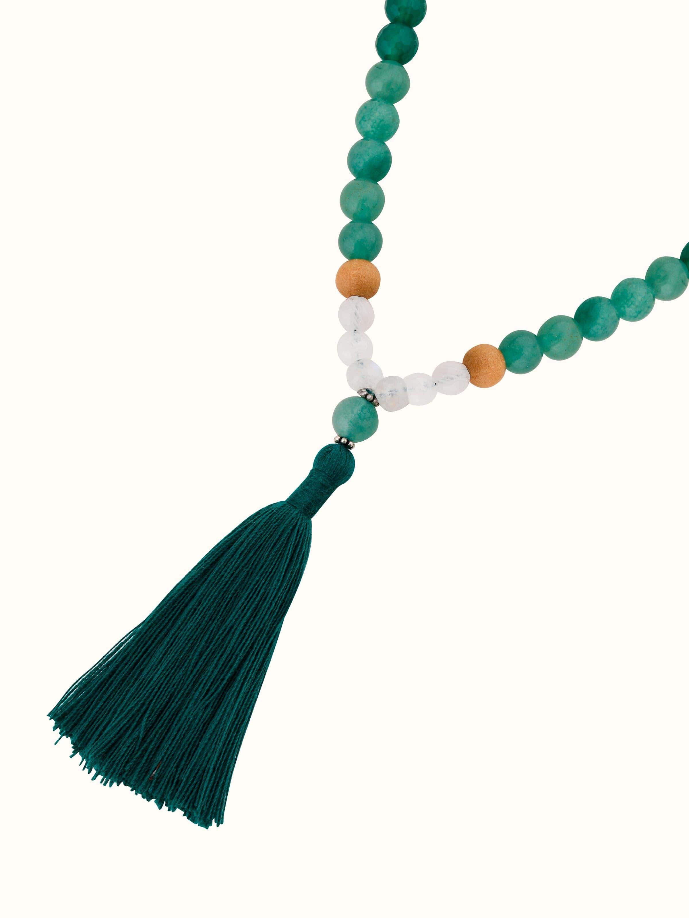 Green Onyx, Green Aventurine & White Moonstone Silver Mala displayed with a natural background for elegance
