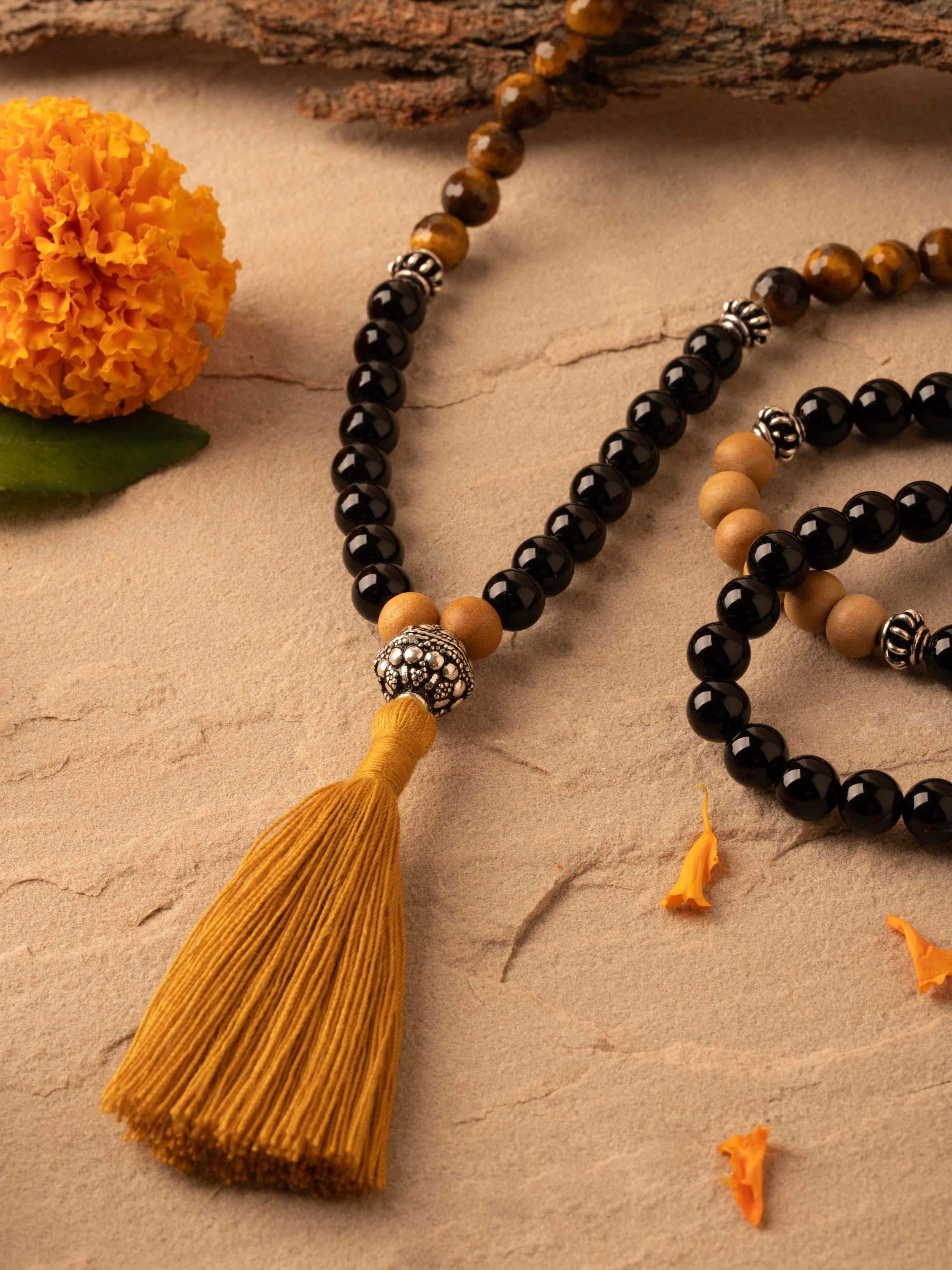 Side view of Tiger Eye & Black Onyx Silver Mala highlighting the detailed craftsmanship of the silver spacer beads.