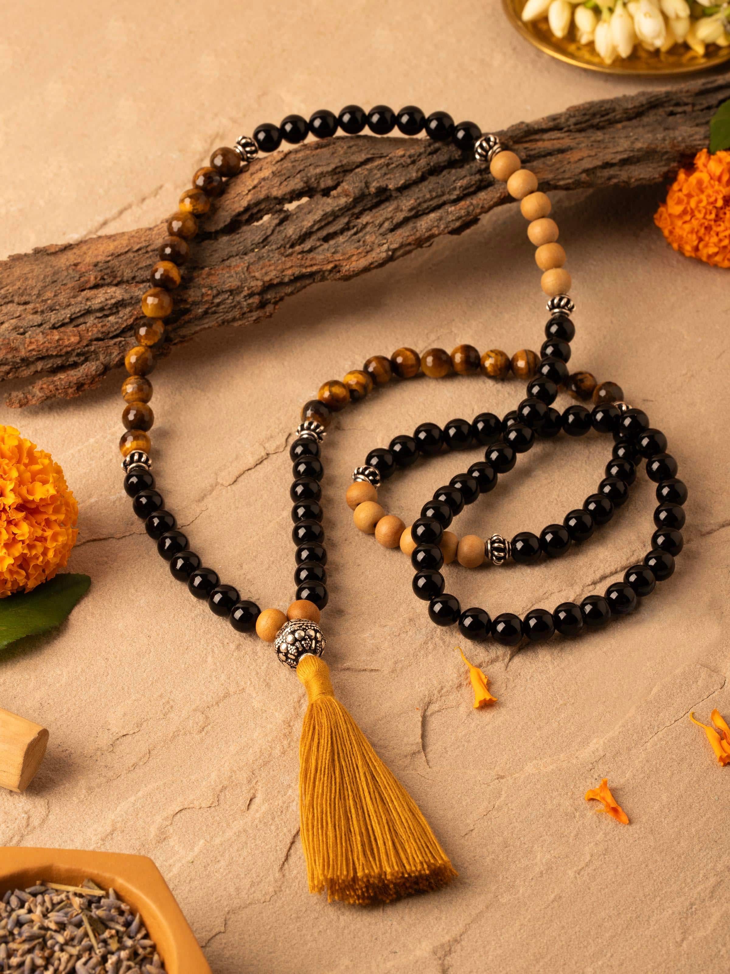 Close-up of Tiger Eye & Black Onyx Silver Mala focusing on the texture and color contrast between the beads.