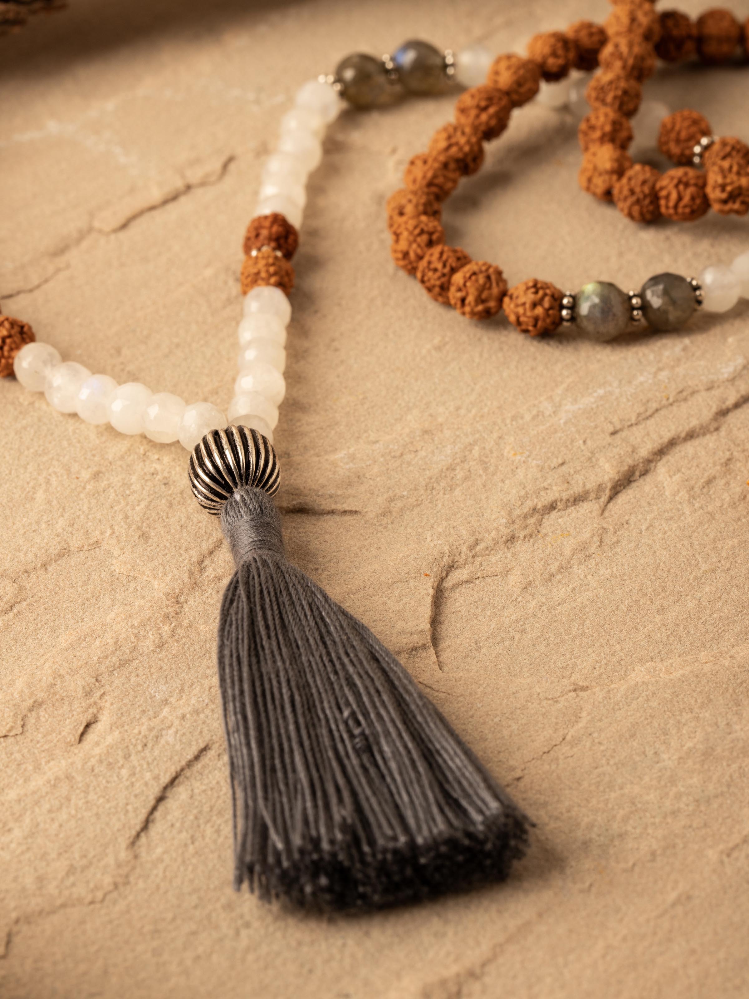 Detailed close-up of Labradorite, White Moonstone & Rudraksha Silver Mala, focusing on the bead textures and finishes.